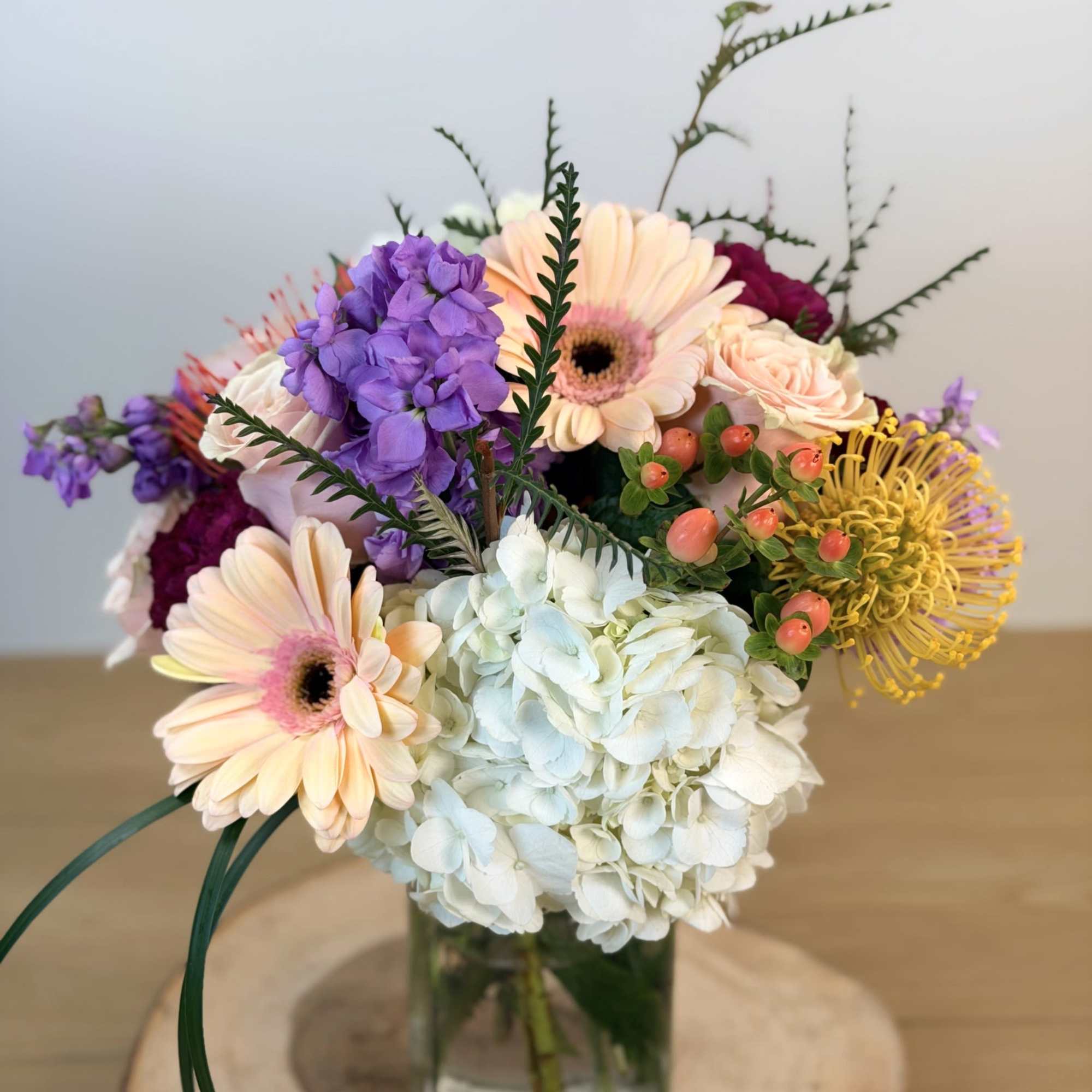 This Gorgeous Arrangement features a wonderful mixture of roses, hydrangea, and other