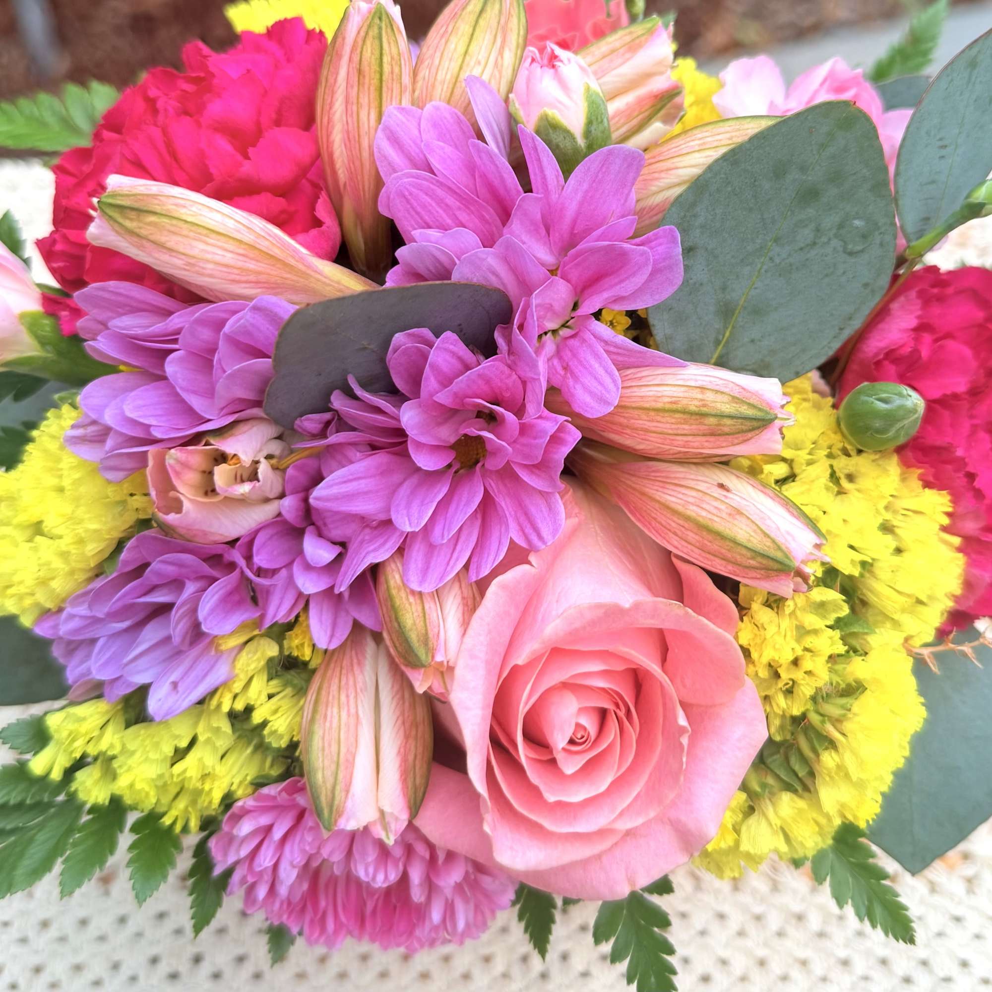 Enjoy the beautiful blooms of the season. Stunning floral arrangement designed thinking
