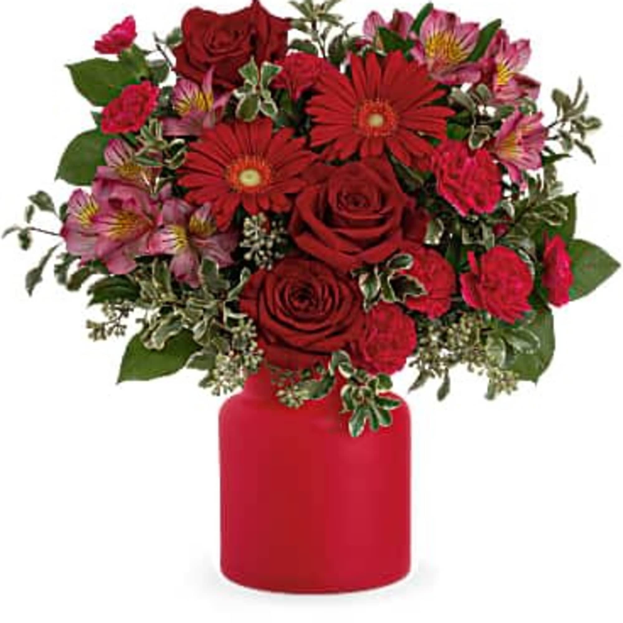 Red roses and pink flowers arranged in a red vase