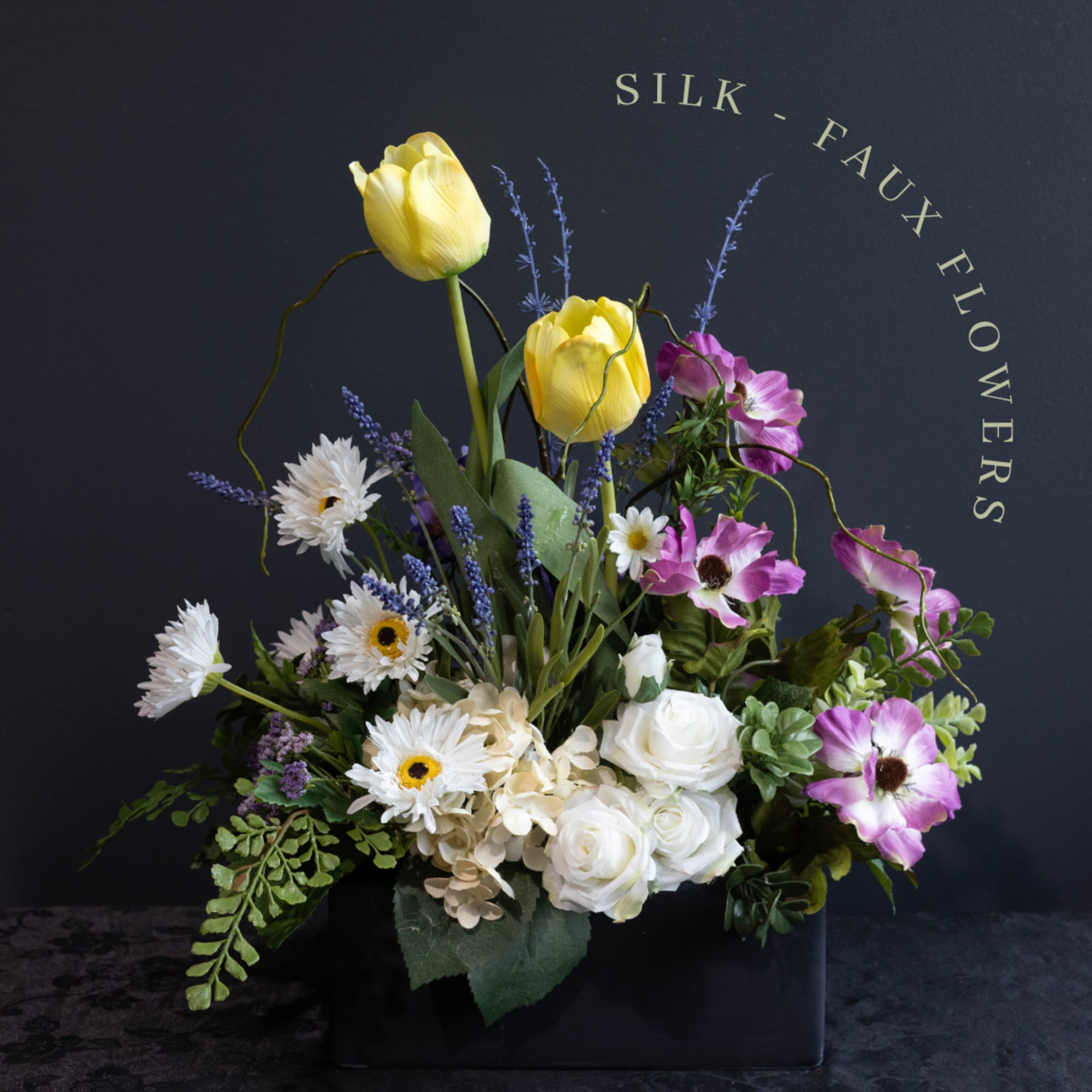 A beautiful silk-faux flower arrangement that will be everlasting for the recipient.
