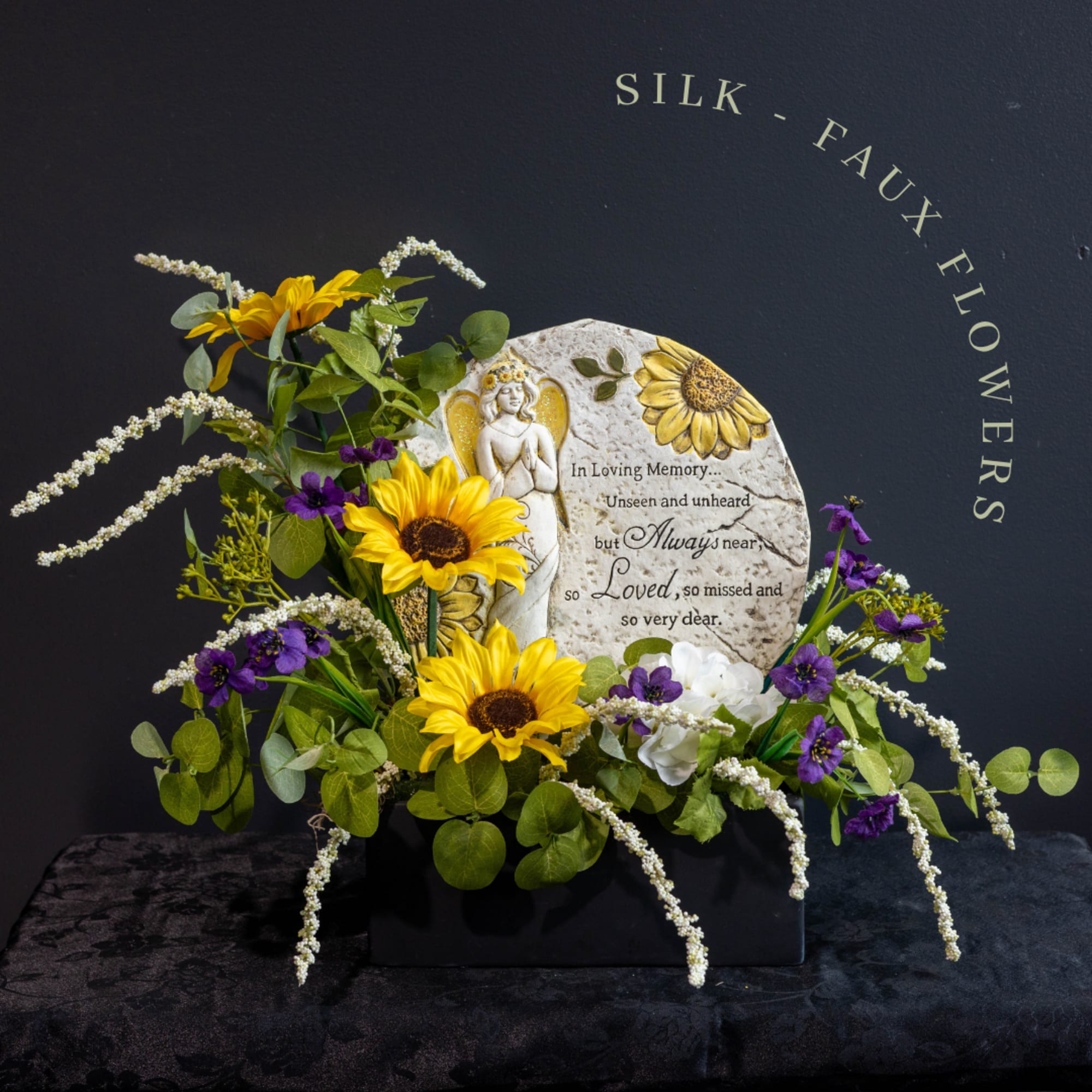 A beautiful silk-faux flower arrangement, with a keepsake stepping stone, that will