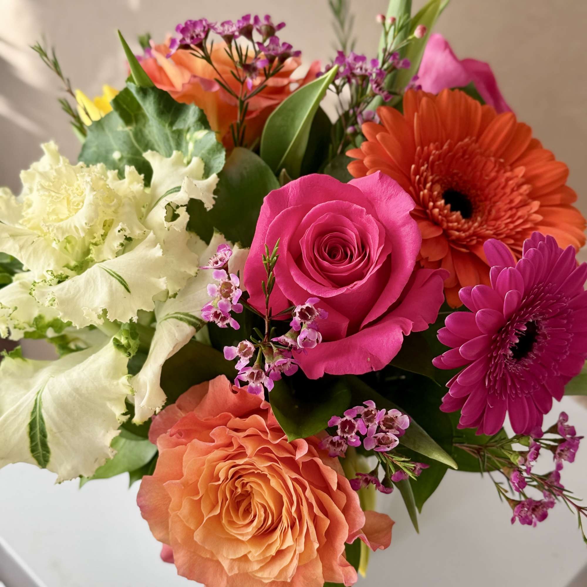 Mixed bouquet with pink, orange, and white flowers