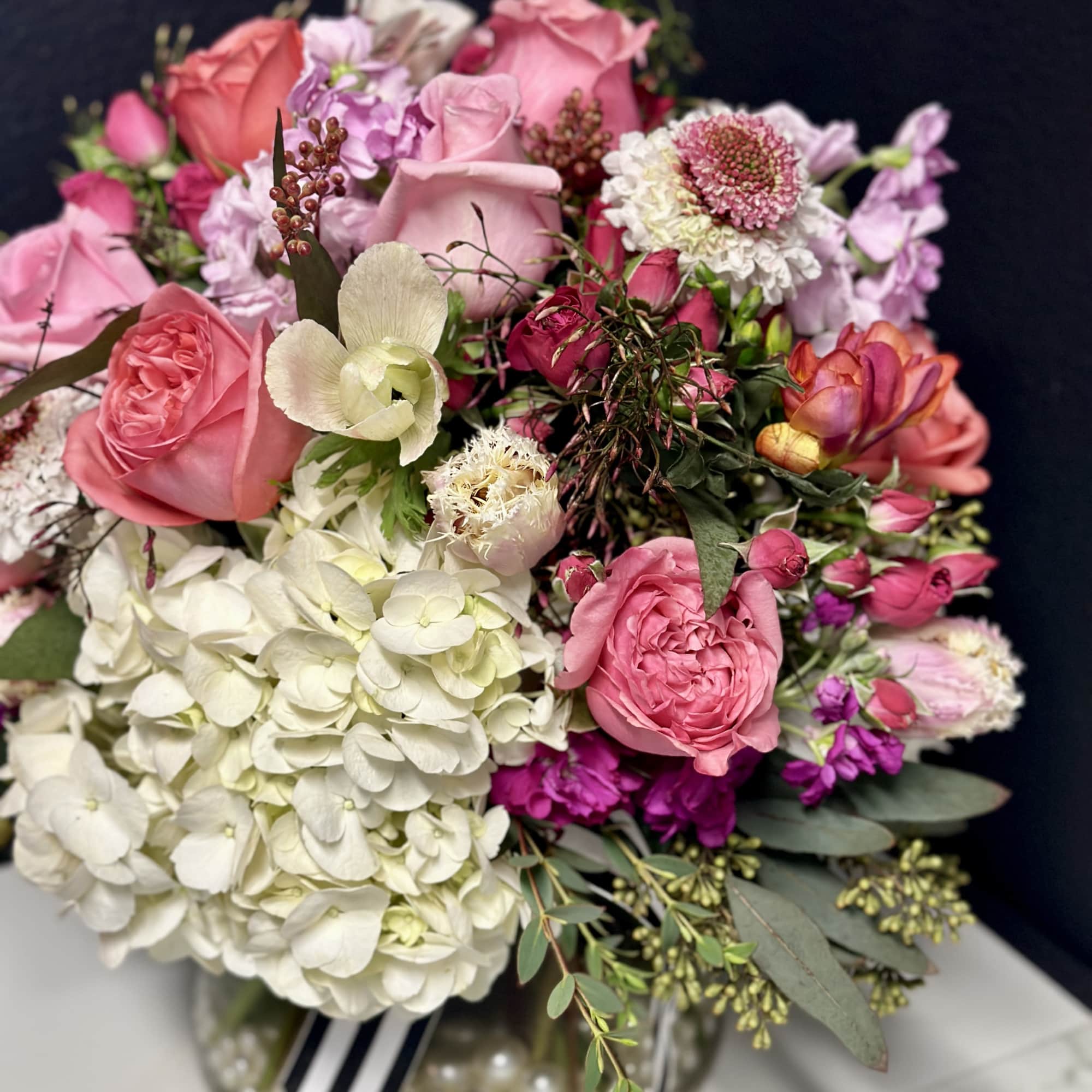 Pink and white mixed bouquet in a glass vase