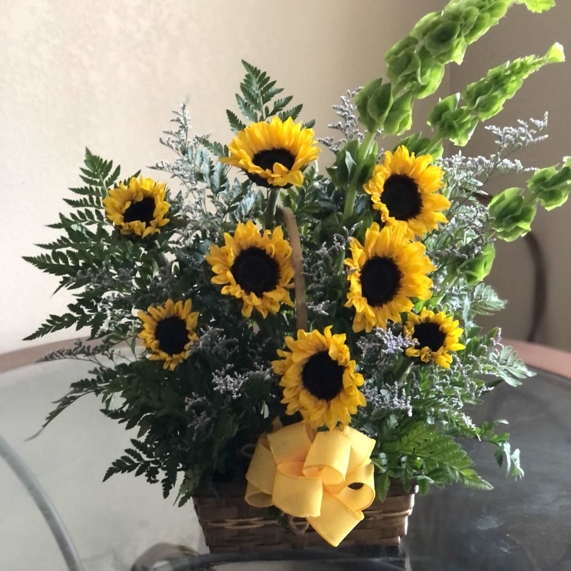This Sunflower basket with white and yellow daises and sunflowers, is the