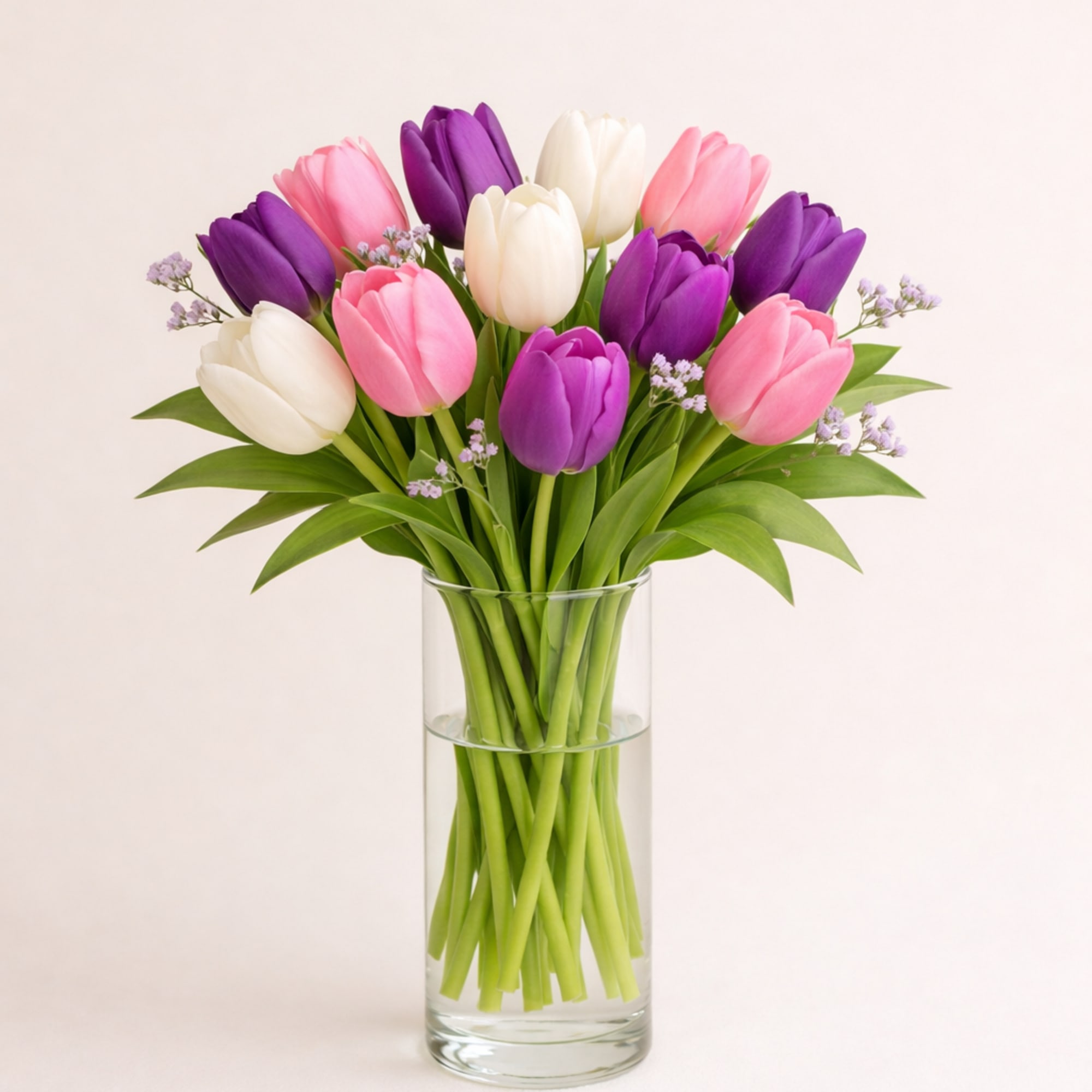 A cheerful mix of three or more tulip colors, loosely gathered with