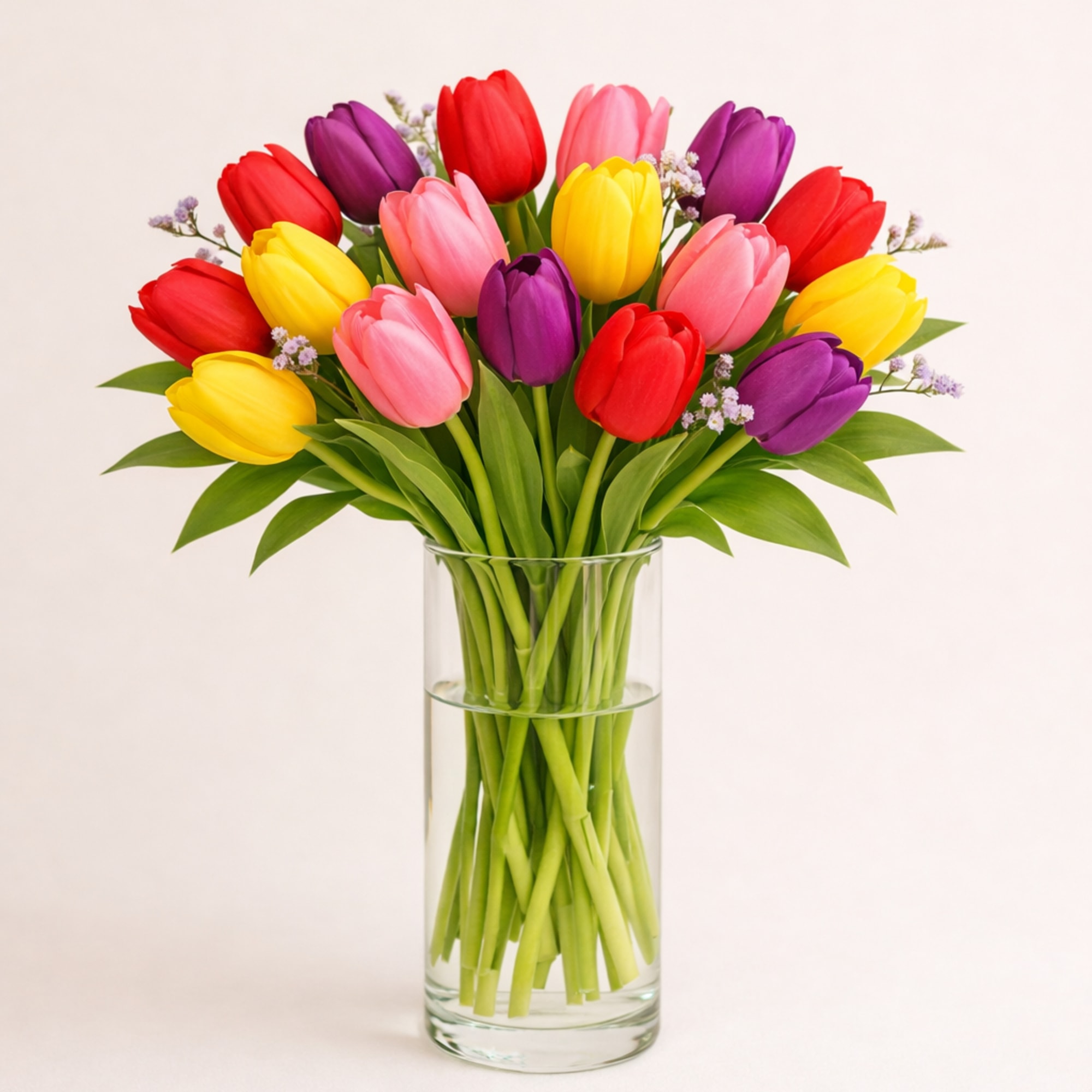 A cheerful mix of three or more tulip colors, loosely gathered with