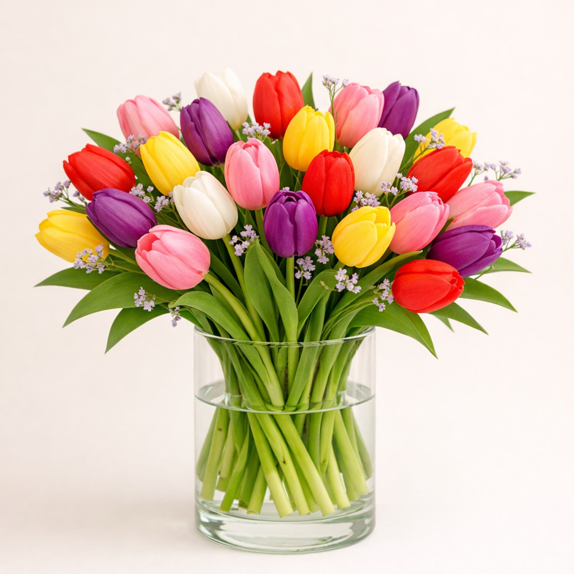 A cheerful mix of three or more tulip colors, loosely gathered with