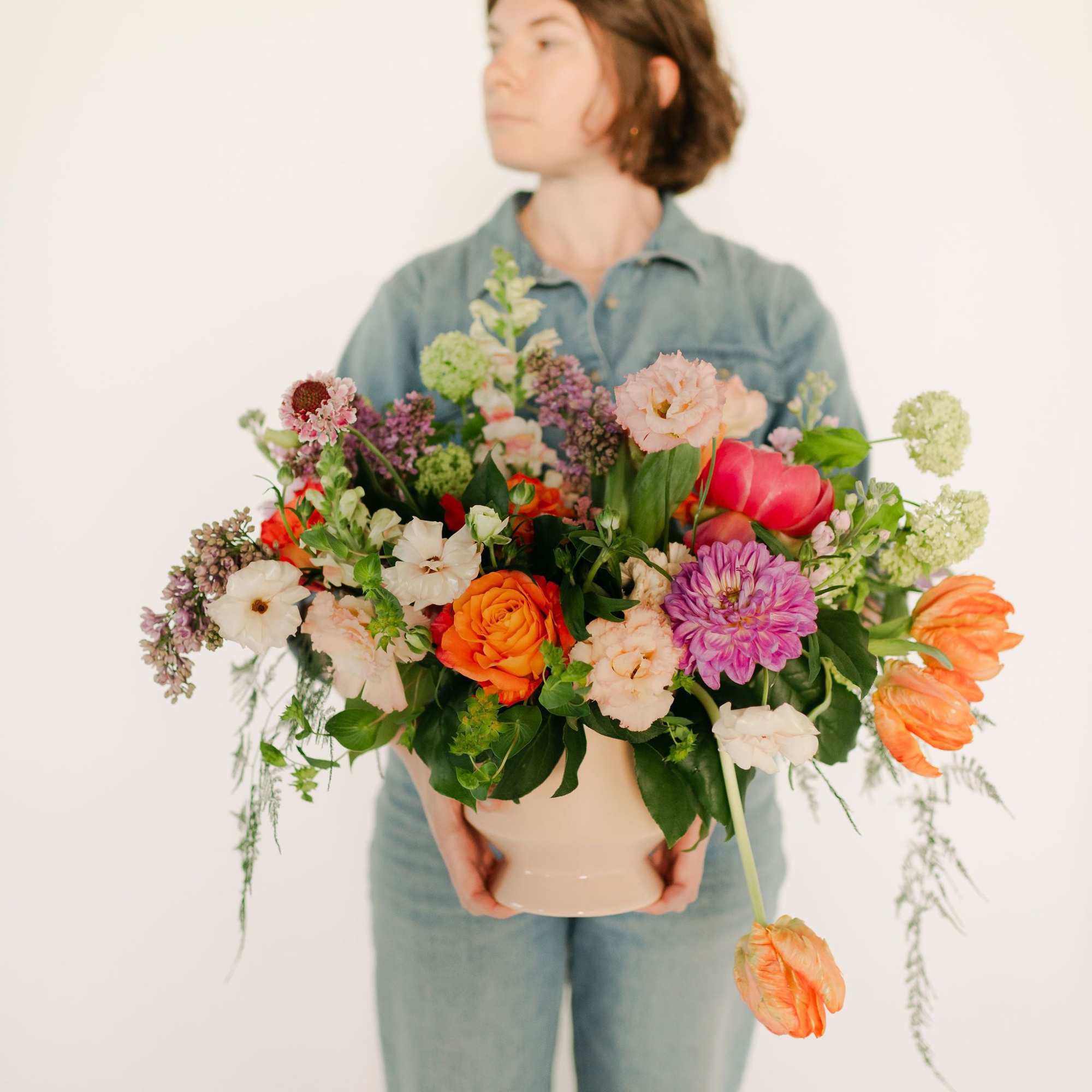 A lush blend of peaches, blush pinks, soft lavenders, and fresh greens