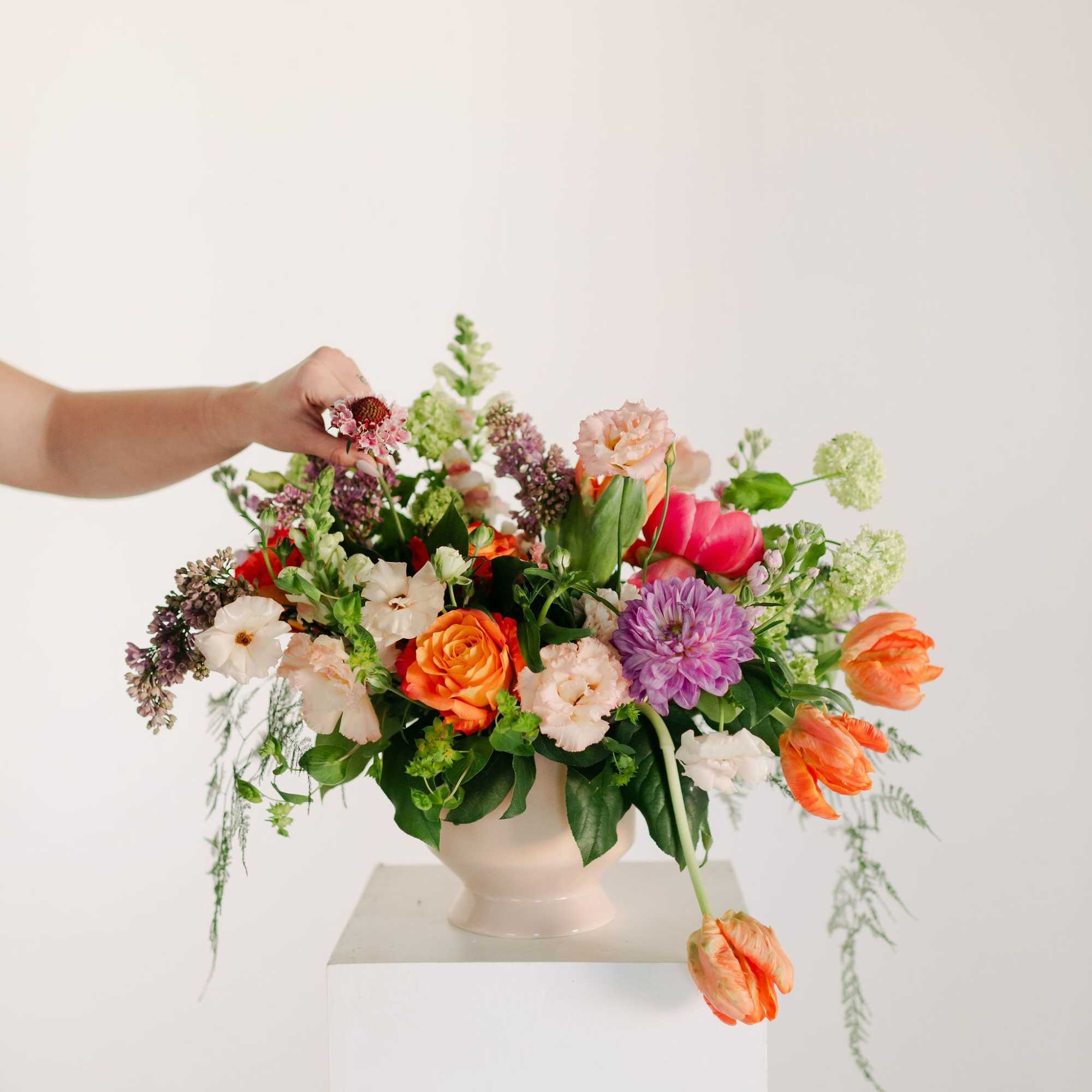 A lush blend of peaches, blush pinks, soft lavenders, and fresh greens