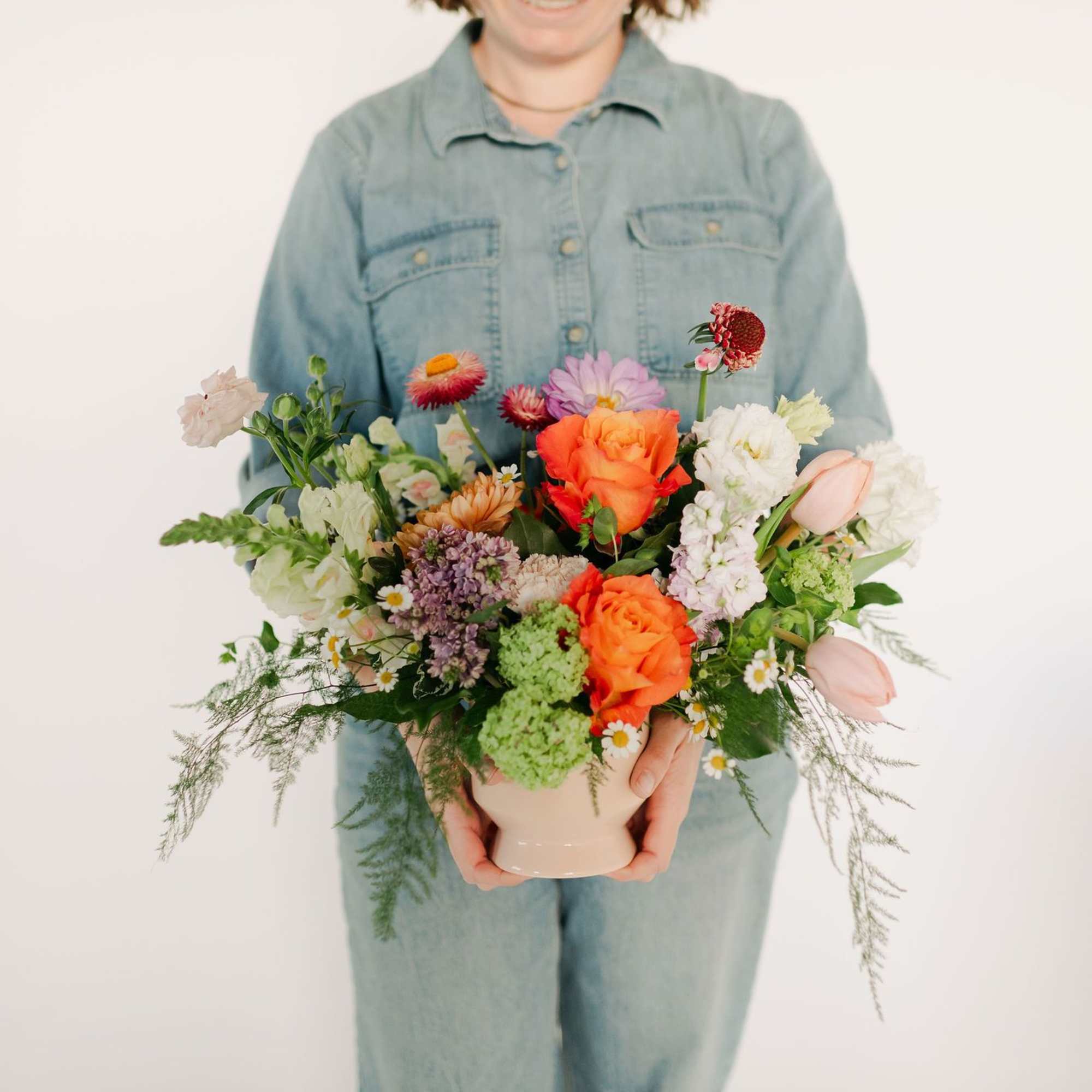 A lush blend of peaches, blush pinks, soft lavenders, and fresh greens