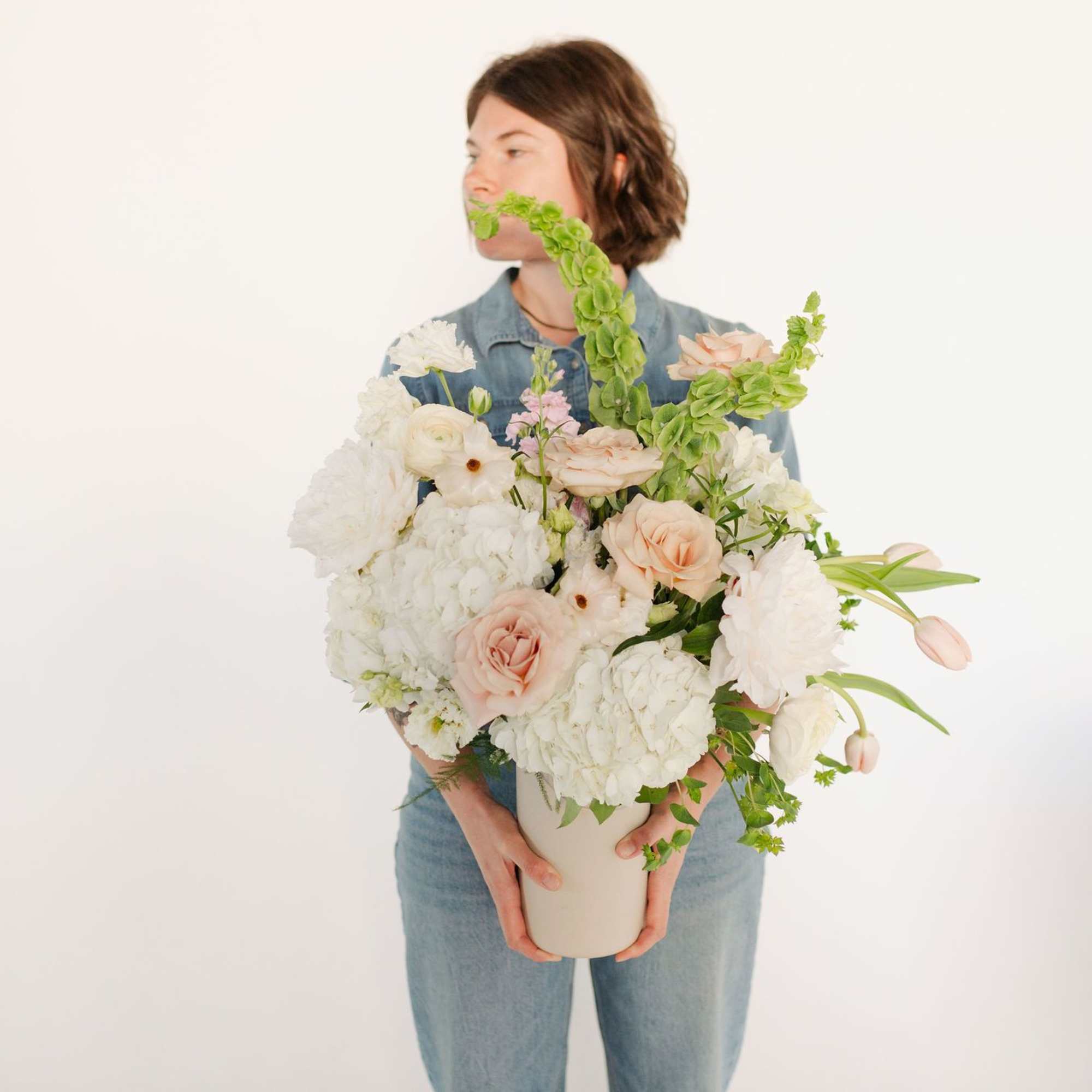 A sweet, pretty arrangement with a sassy edge, this modern twist on