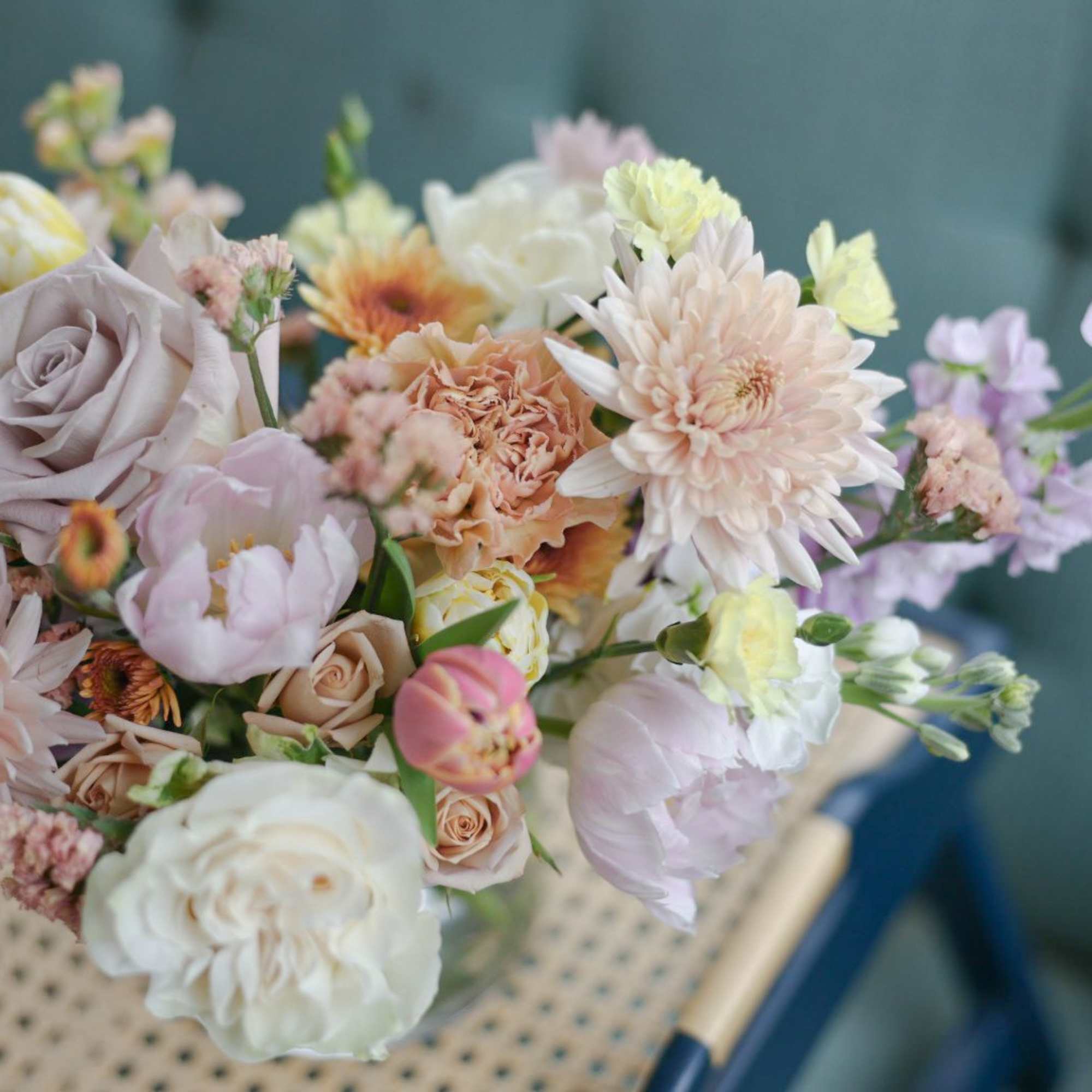 Pastel bouquet with roses, chrysanthemums, and small lavender flowers