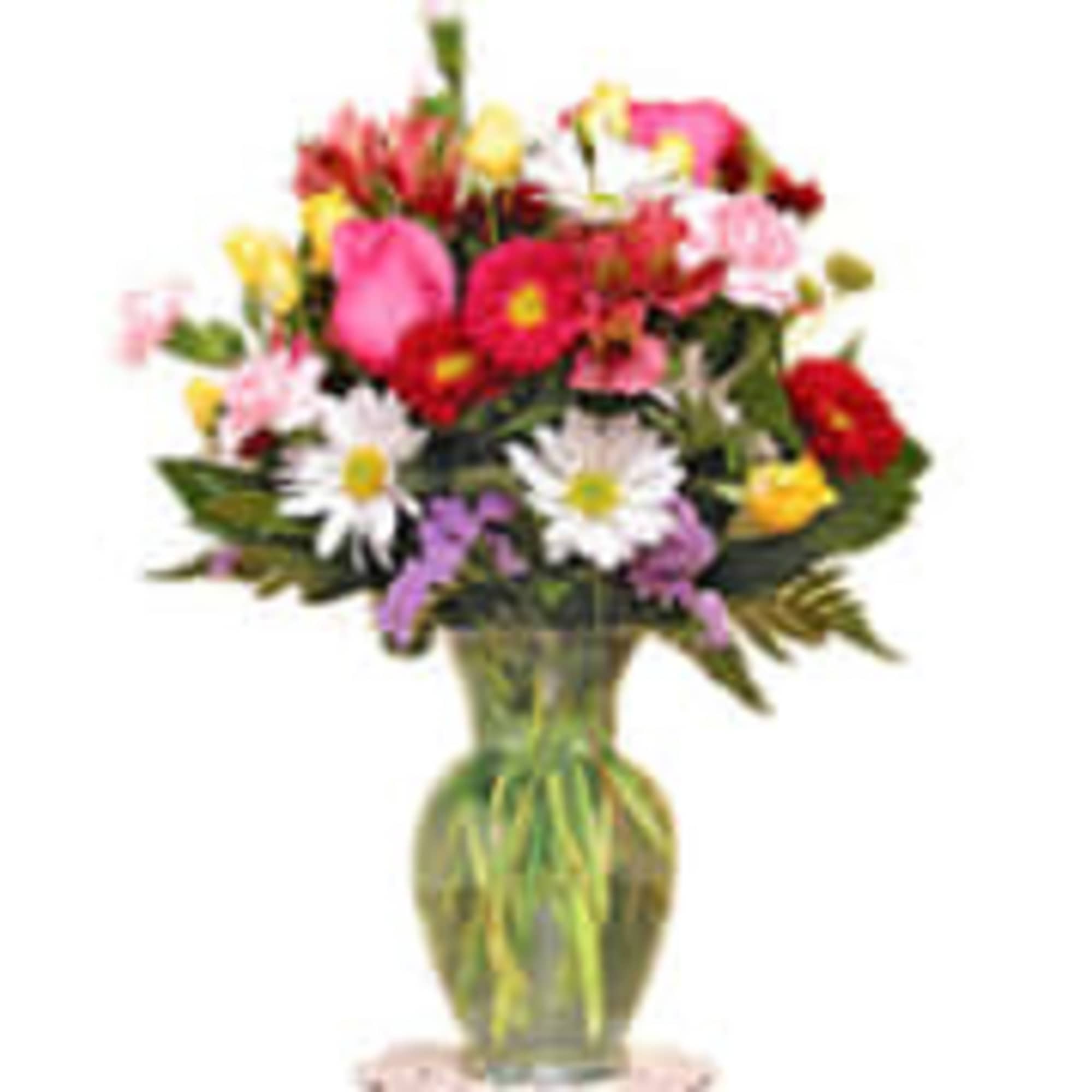 Mixed bouquet of colorful flowers in a glass vase