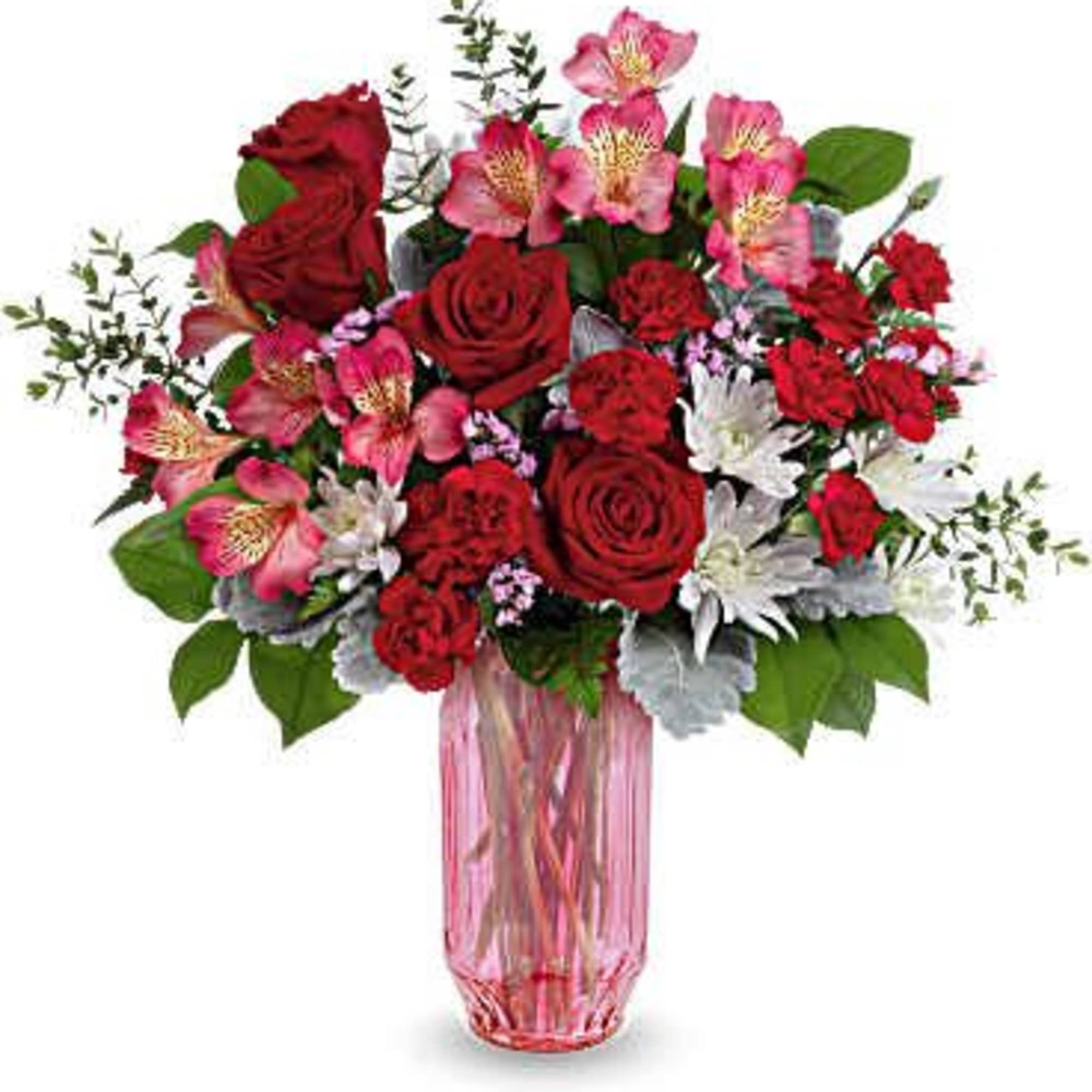 Red roses and pink alstroemeria in a pink glass vase