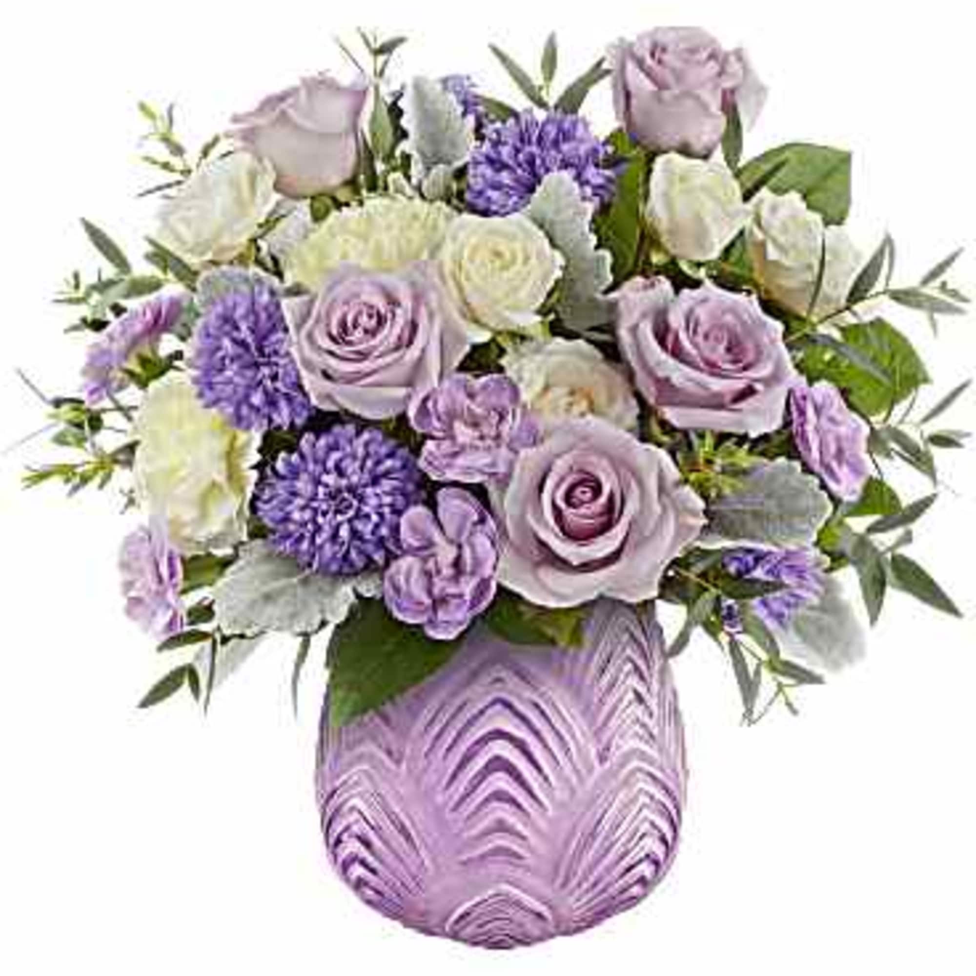 Lavender and white roses arranged in a purple vase