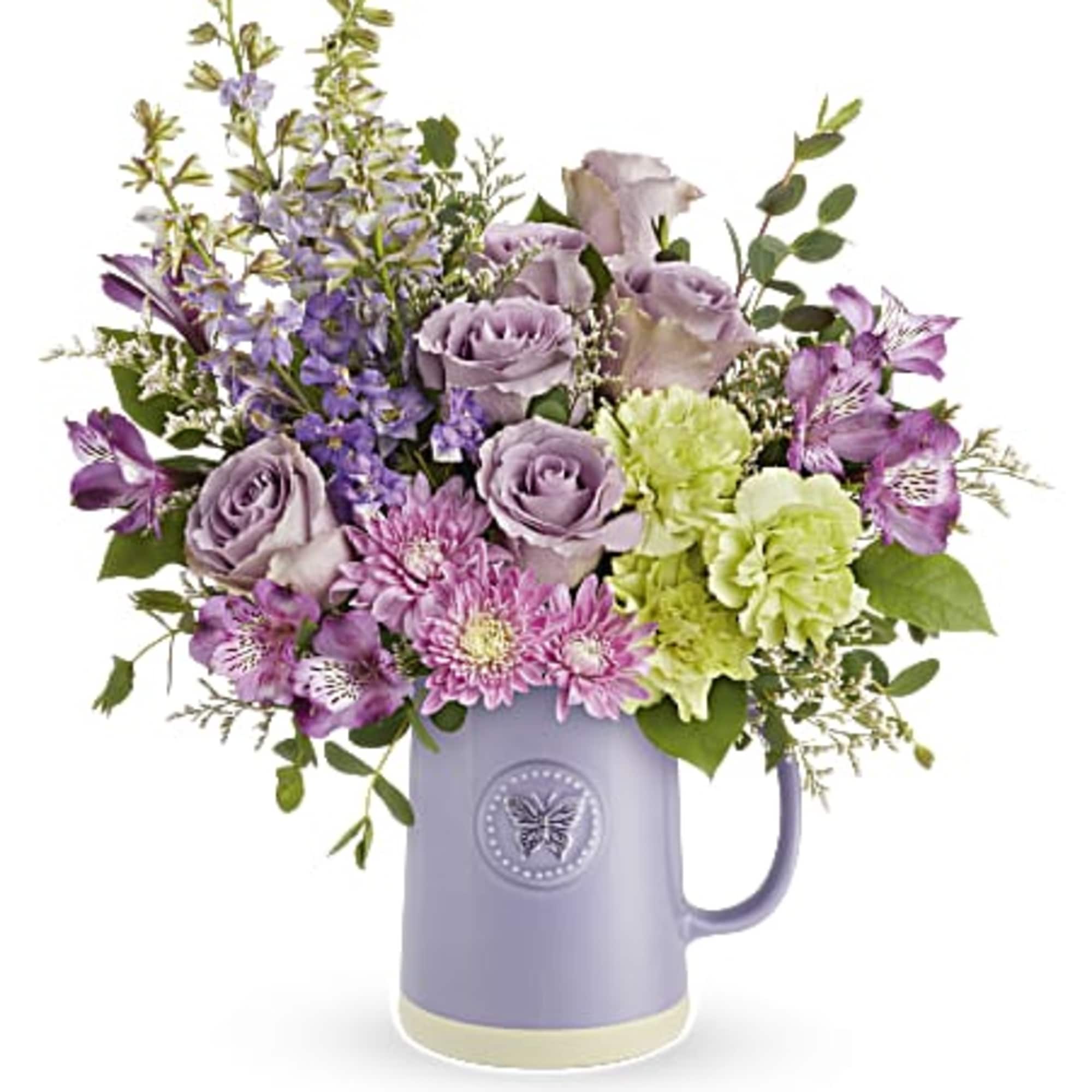 Lavender and pink bouquet in a purple mug vase