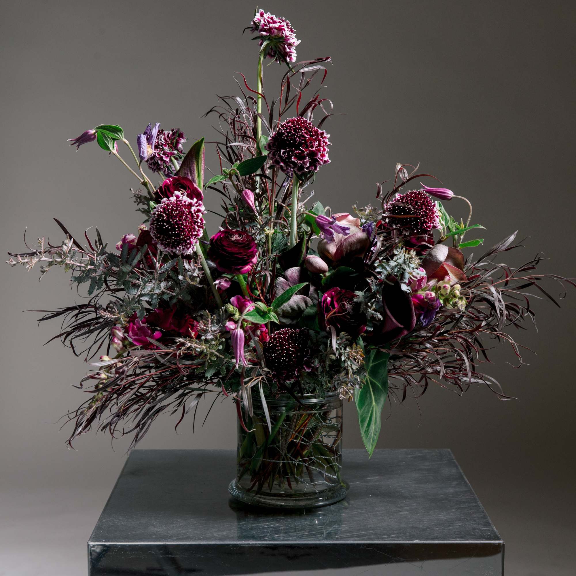 ALL DESIGNS IN PHOTOS ARE DELUXE +
Moody, romantic, and undeniably modern-this tall