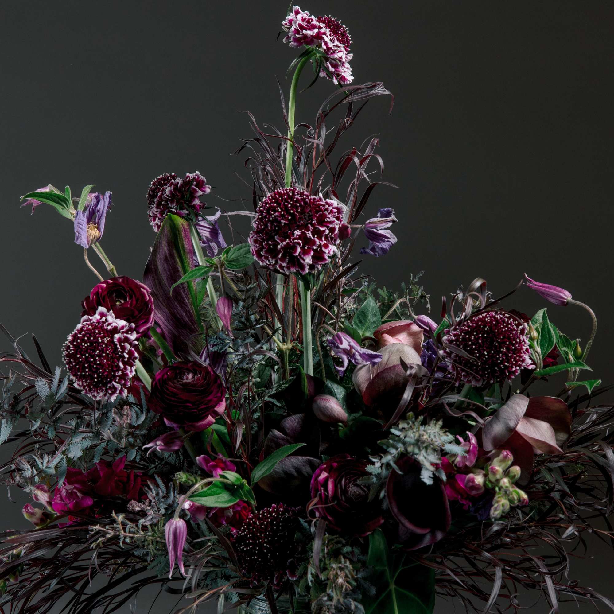 ALL DESIGNS IN PHOTOS ARE DELUXE +
Moody, romantic, and undeniably modern-this tall