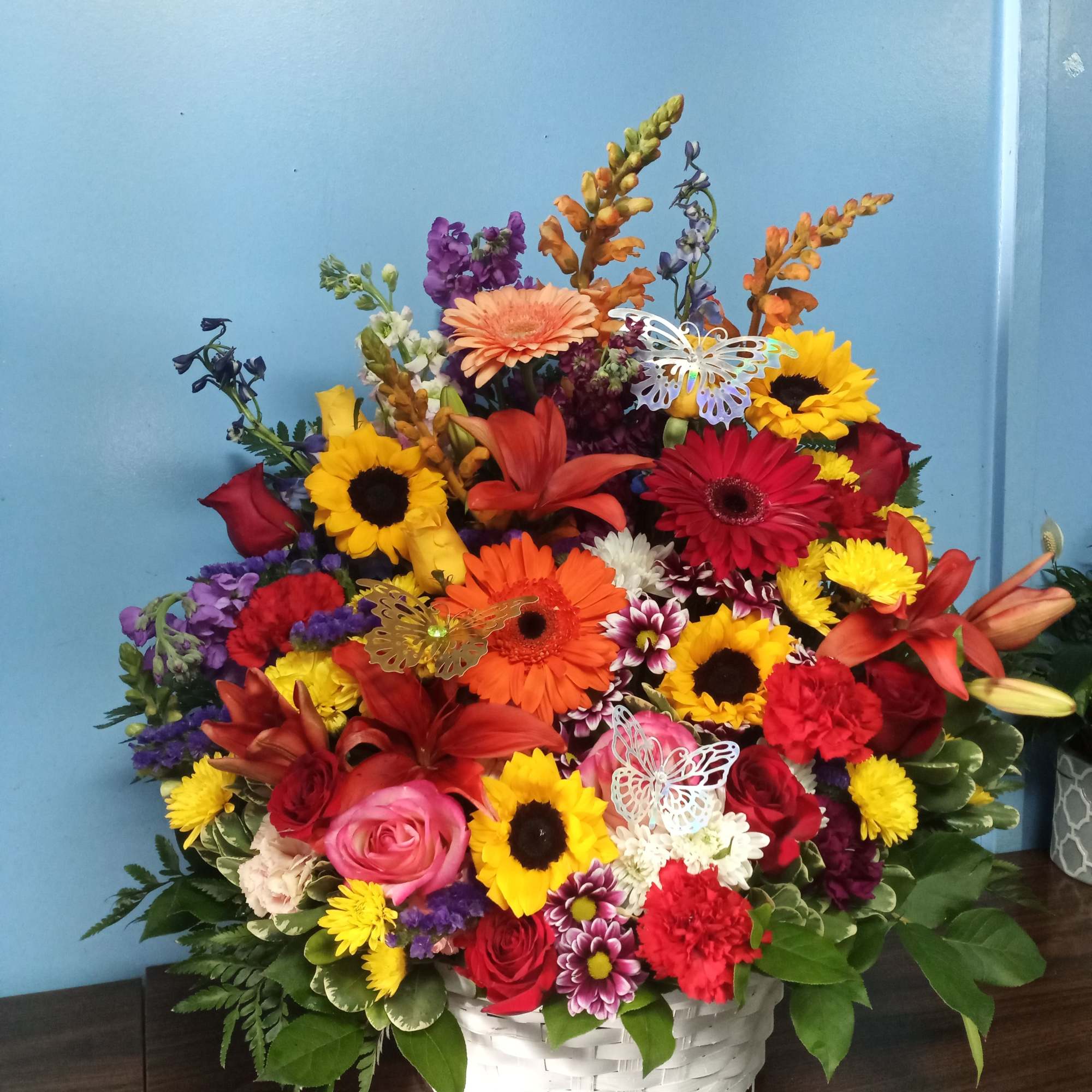 Bright, garden-fresh color takes center stage in this cheerful basket arrangement-perfect as