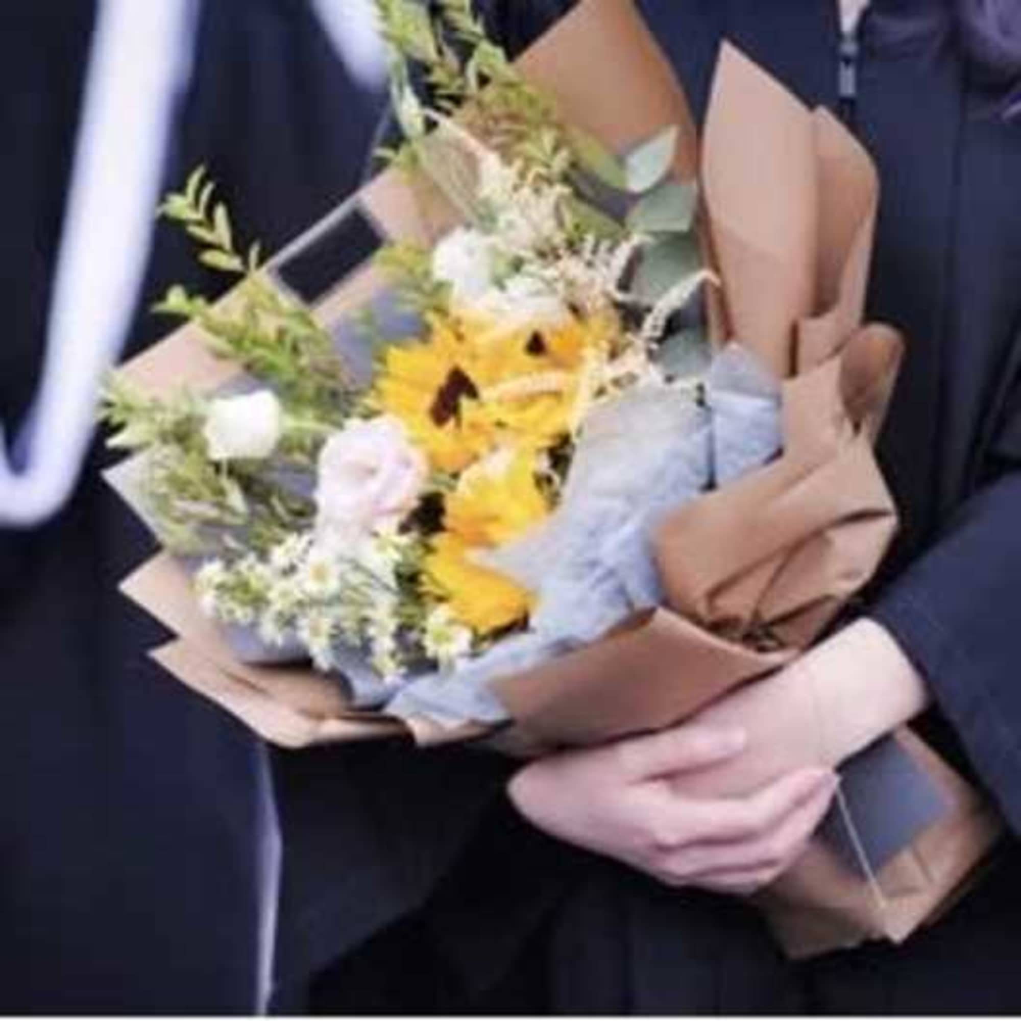Celebrate their milestone with a bouquet as bright as their future. The