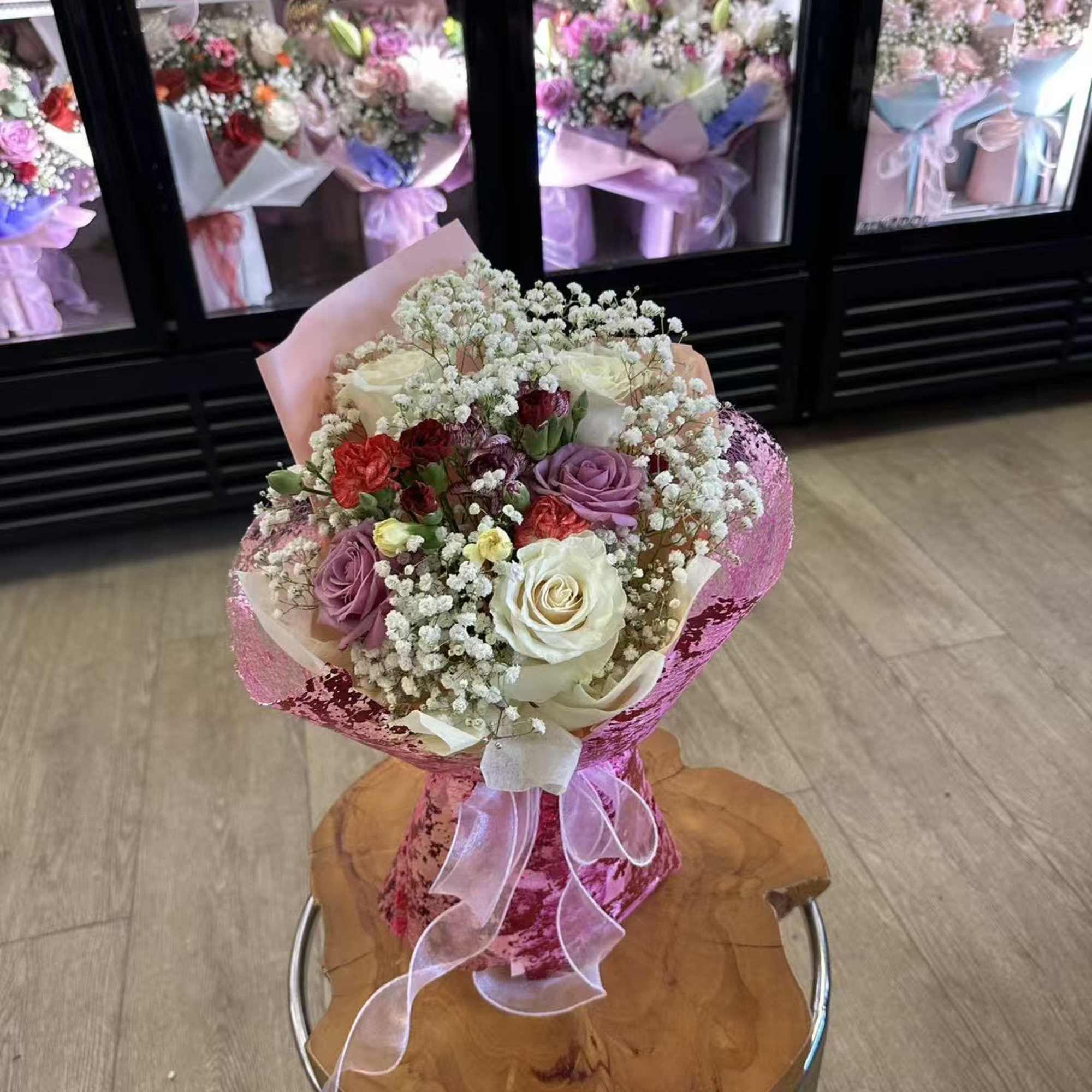 Bouquet is small size with 5 mixed roses and filled flowers 