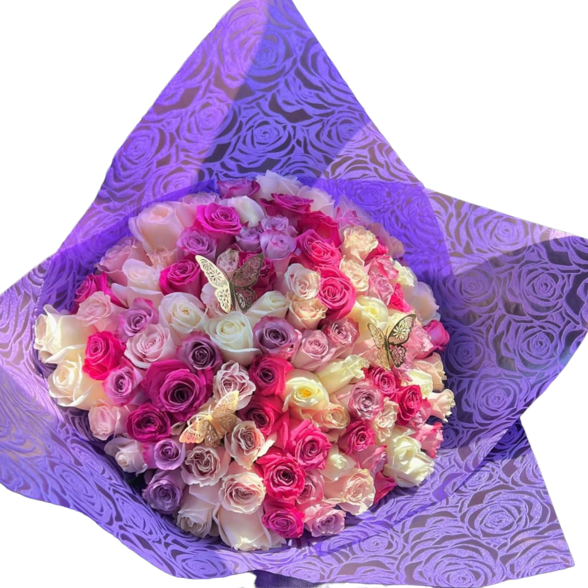 Bouquet of pink, white, and purple roses wrapped in purple paper