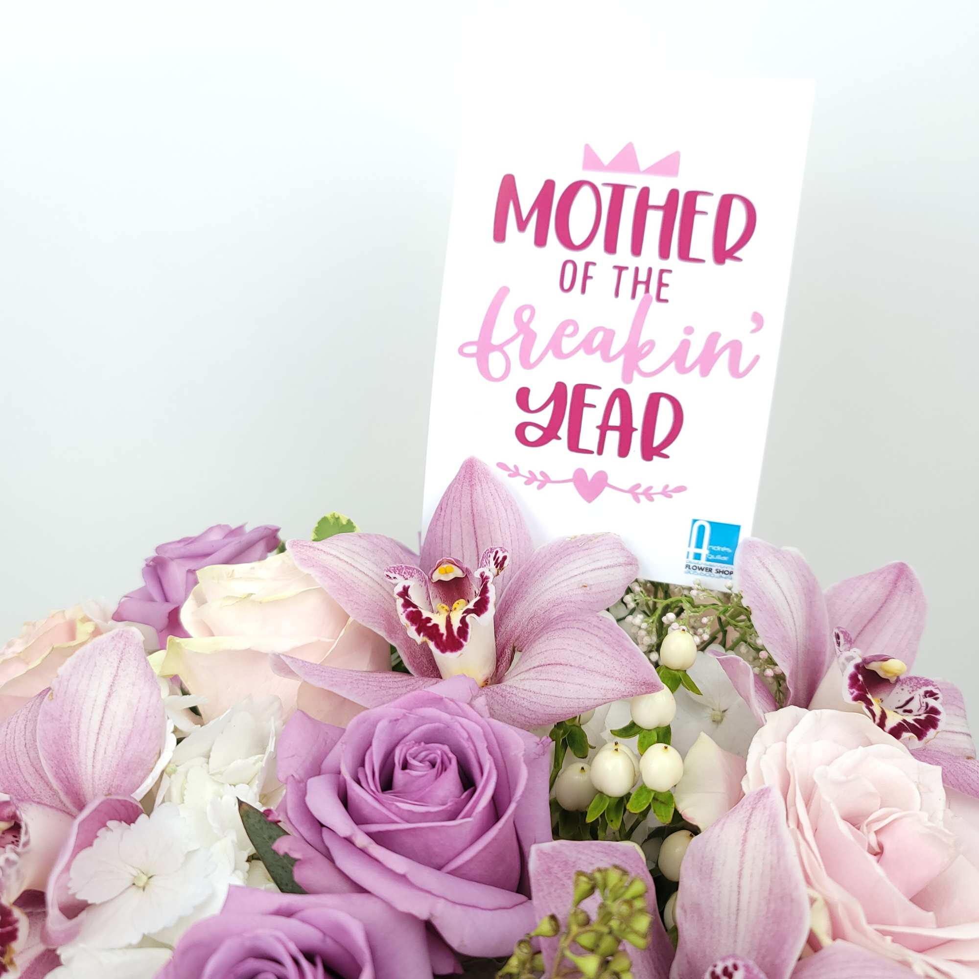 Pink and lavender flower bouquet with a Mother's Day card