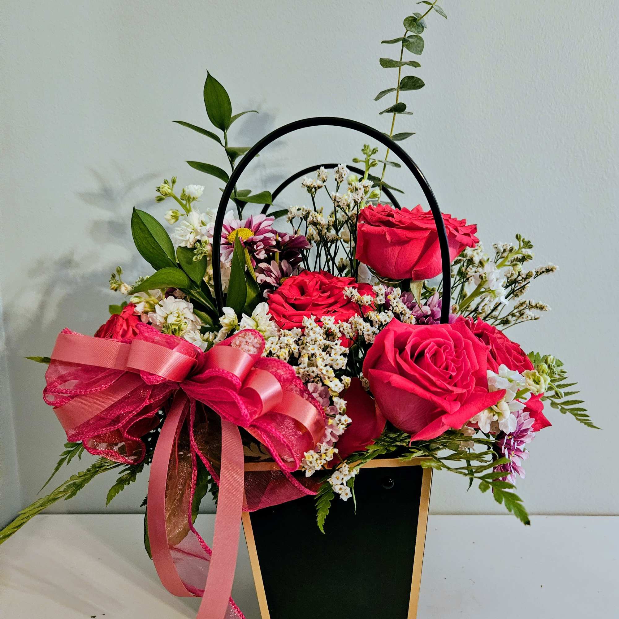 Bright, warm and gift-ready, this Mother's Day flower arrangement mixes roses, carnations