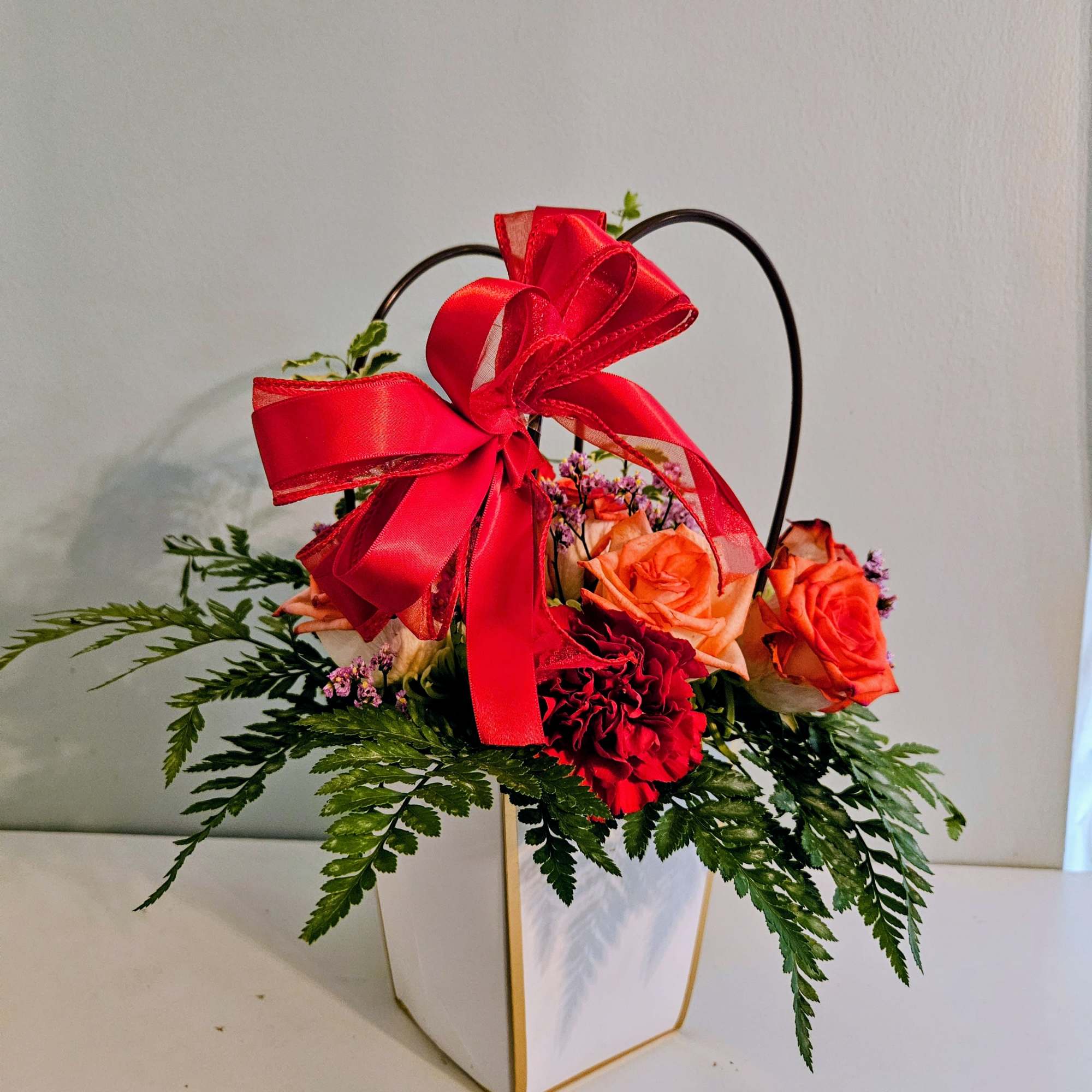 Bright, warm and gift-ready, this Mother's Day flower arrangement mixes roses, carnations