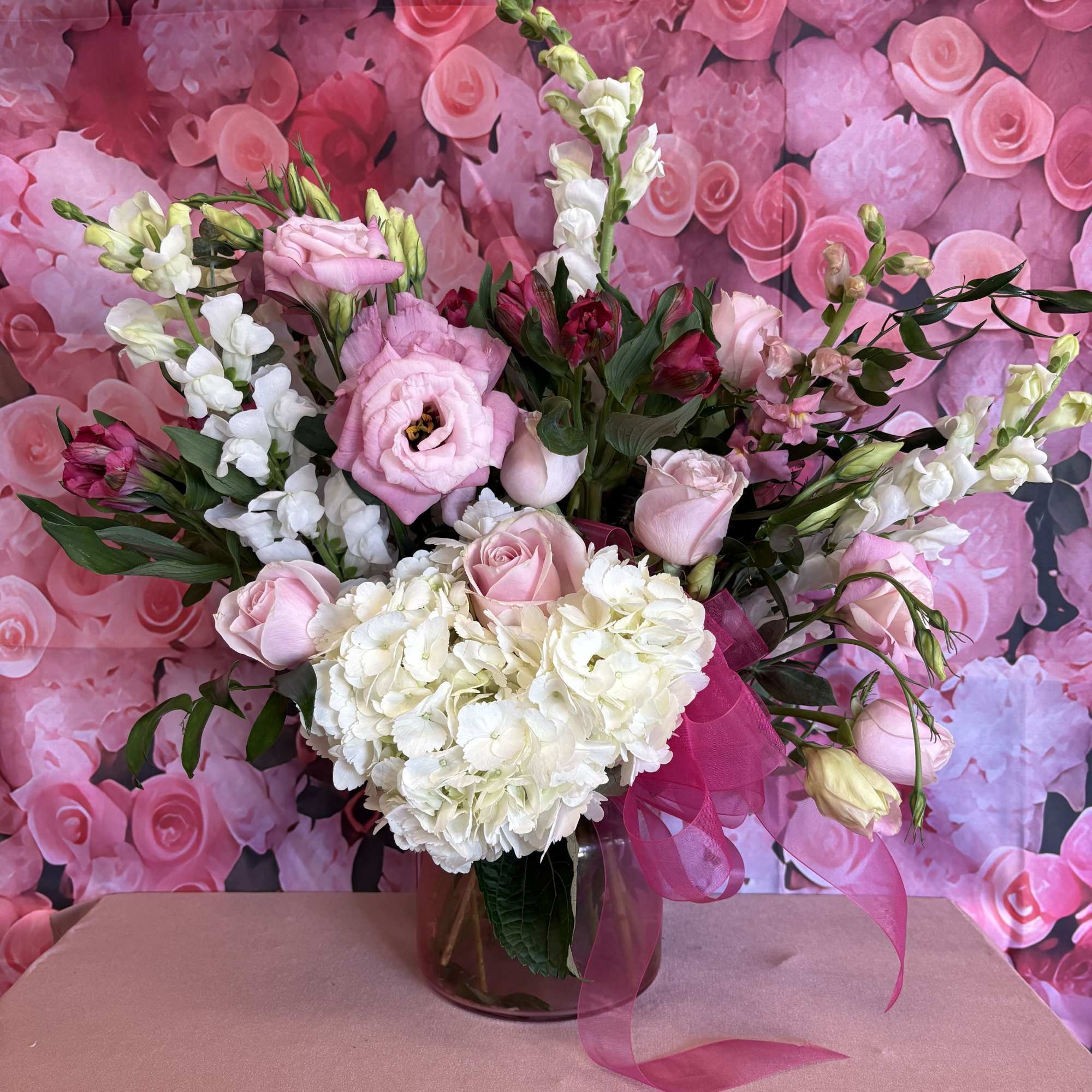 Shades of pinks in pink cinched vase