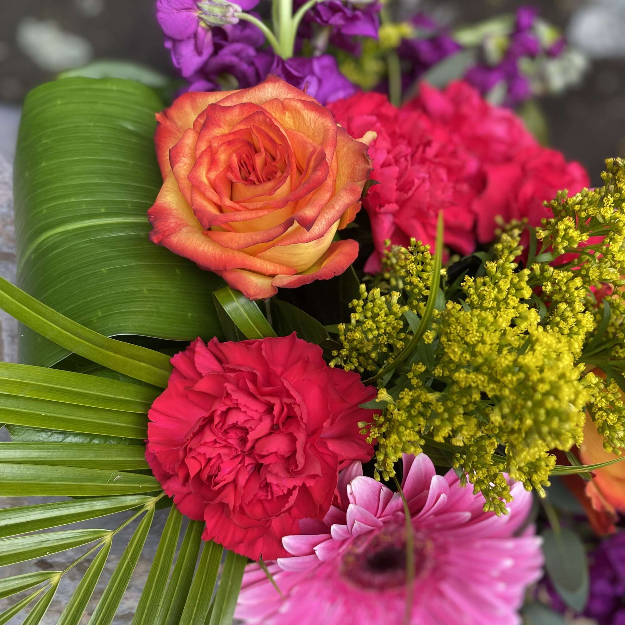 Colorful bouquet with roses, carnations, and gerbera daisies