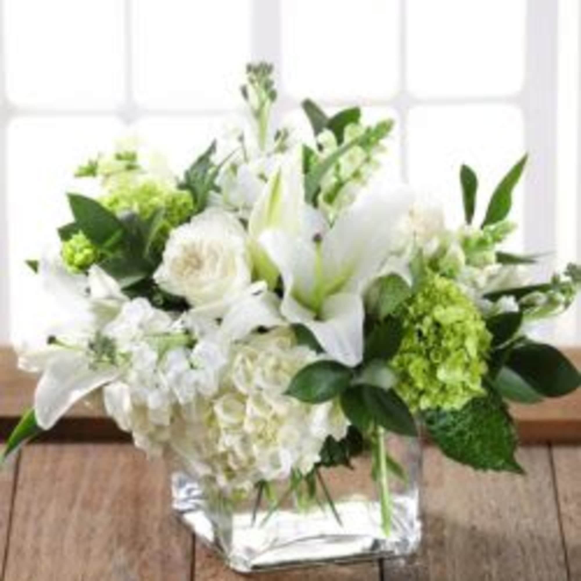  Pet Friendly?
No.  This arrangement contains lilies, which are highly toxic