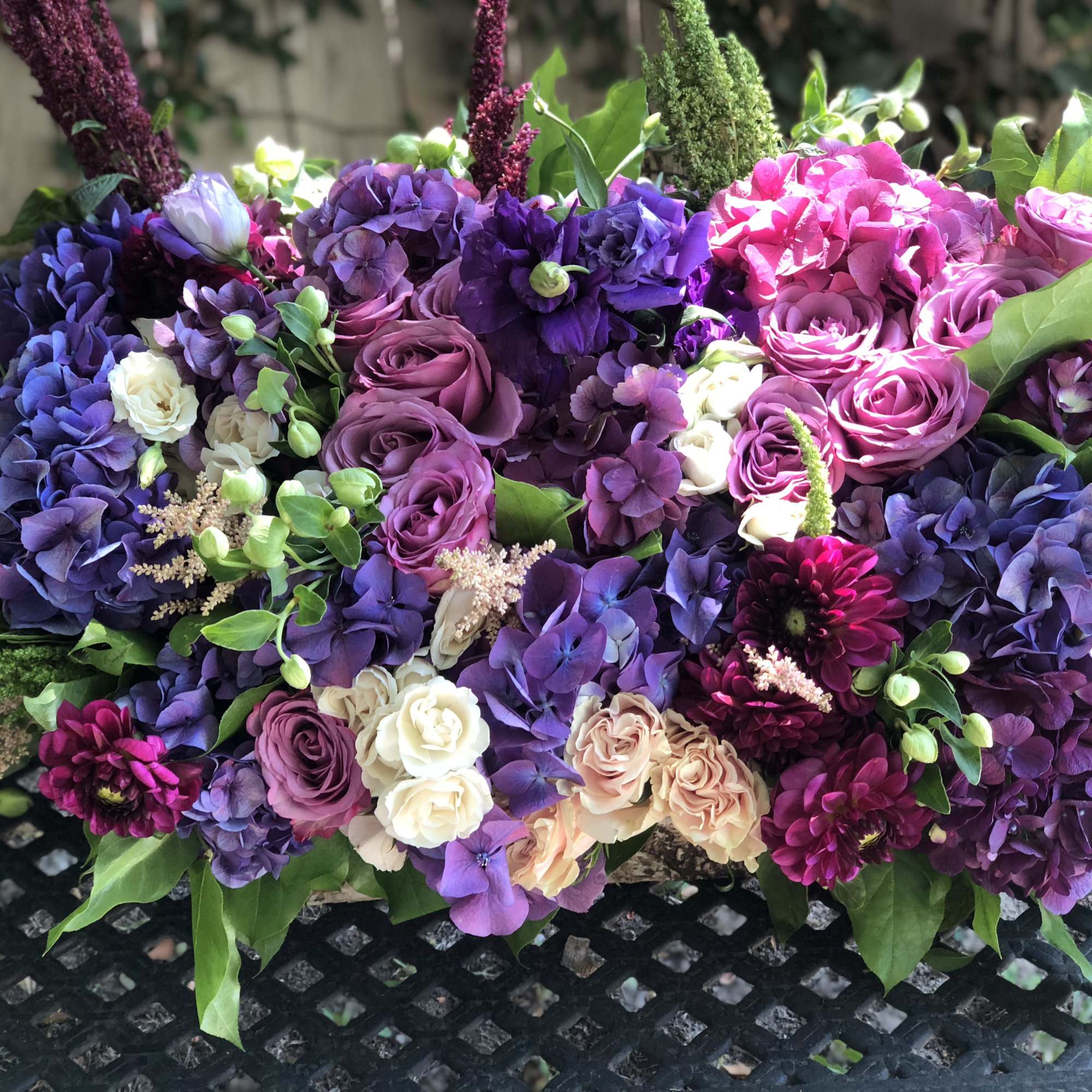 Large bouquet of purple, pink, and cream flowers