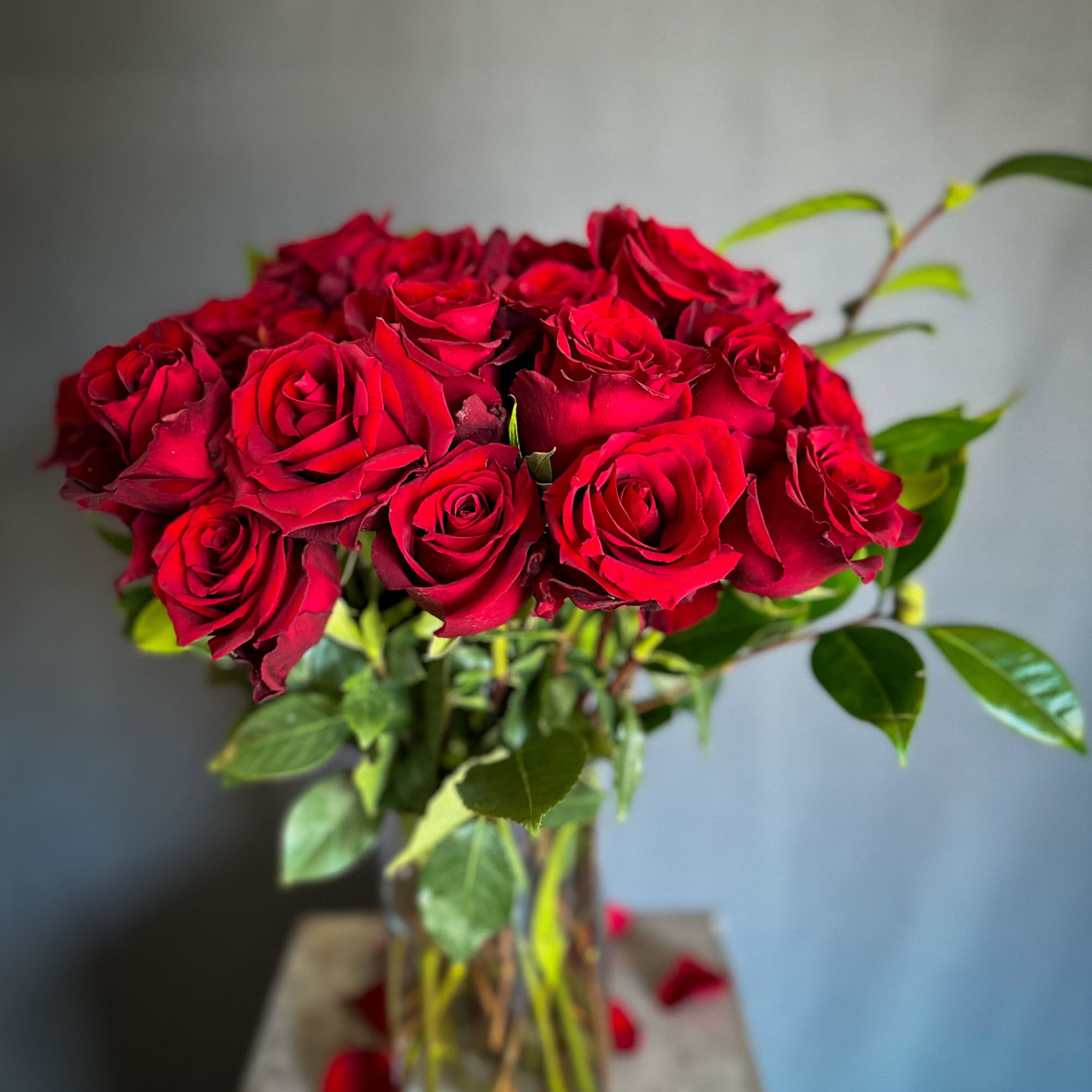 Bouquet of red roses in a clear glass vase
