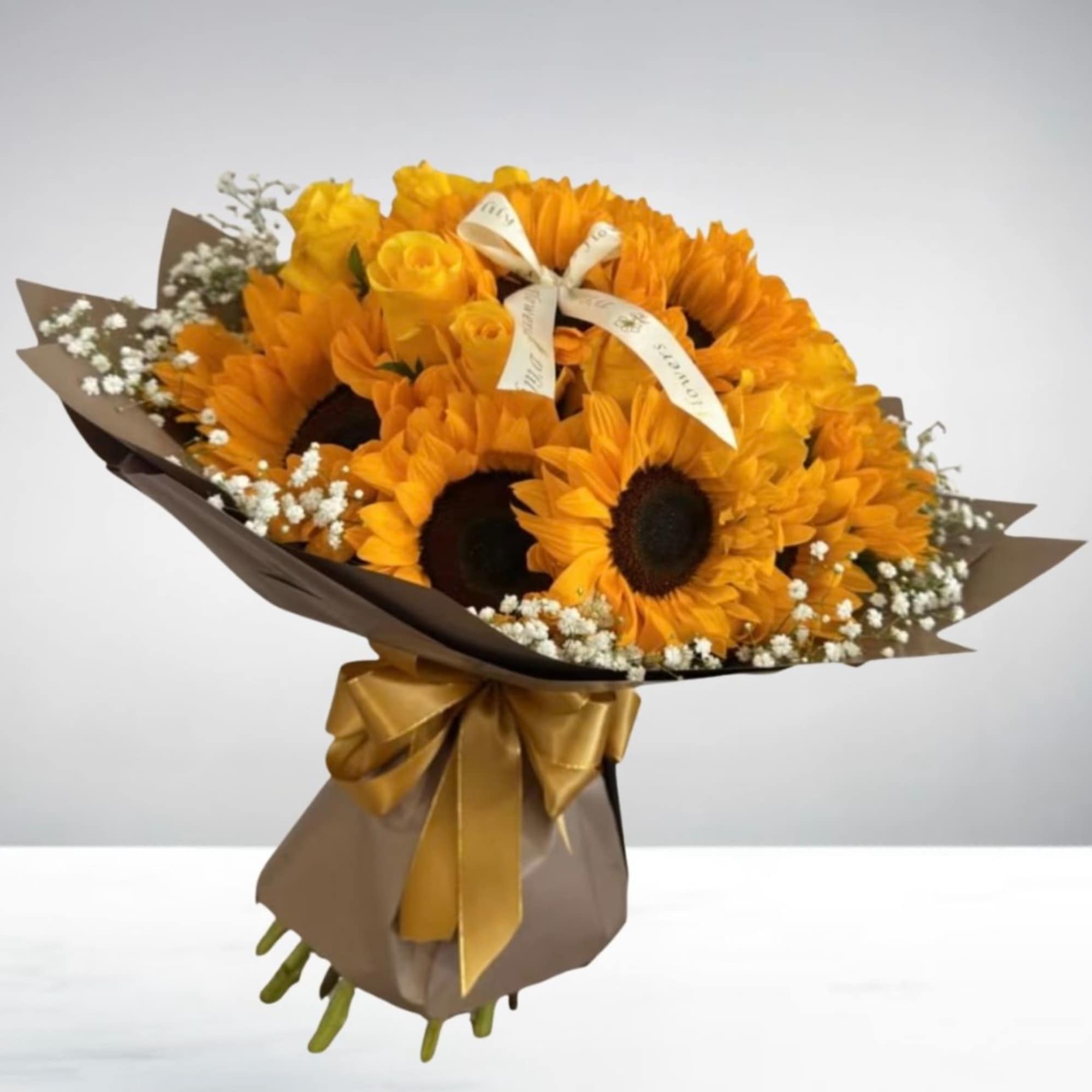 A beautiful bouquet made of yellow roses and stunning sunflowers perfectly put