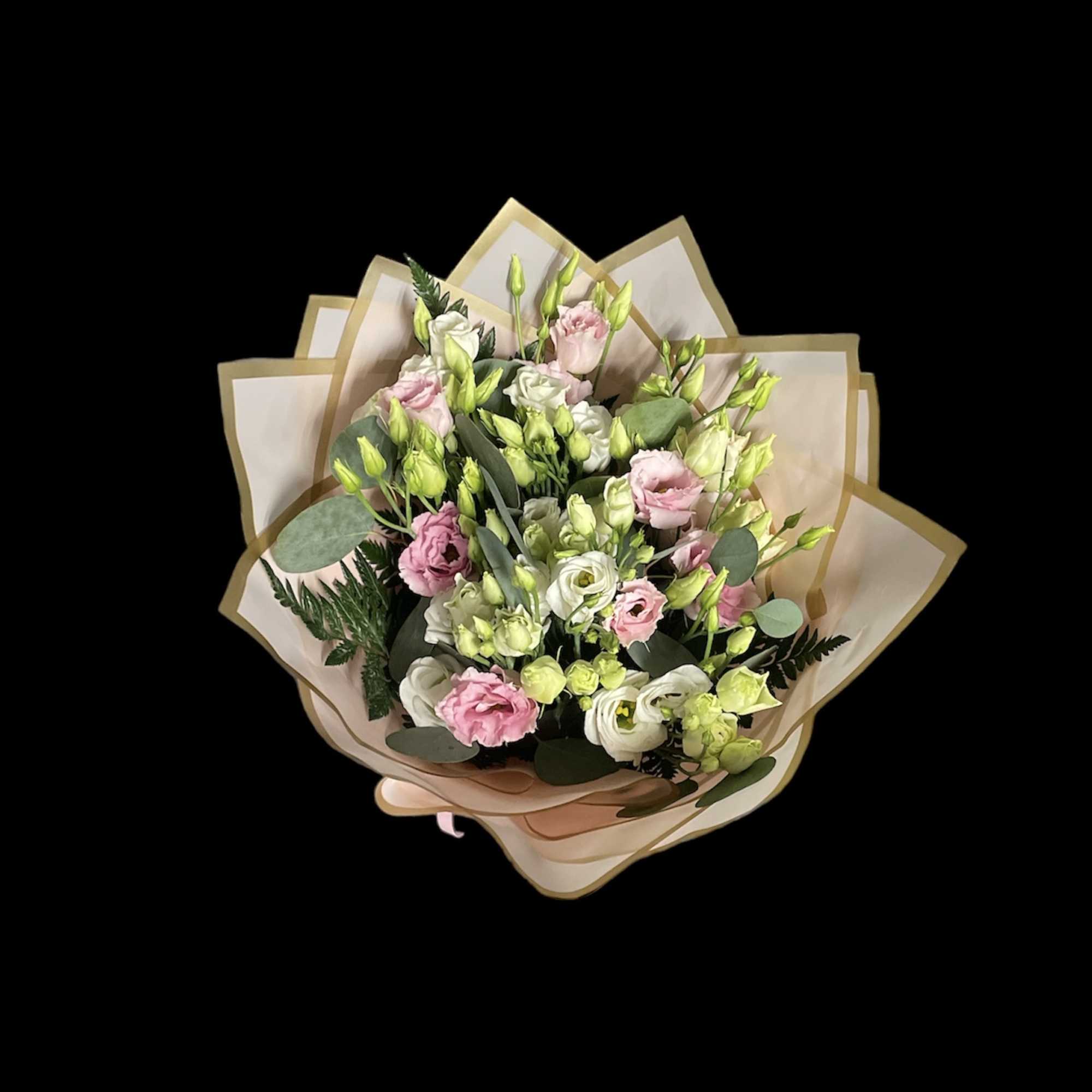 Bouquet of pink and white flowers wrapped in beige paper
