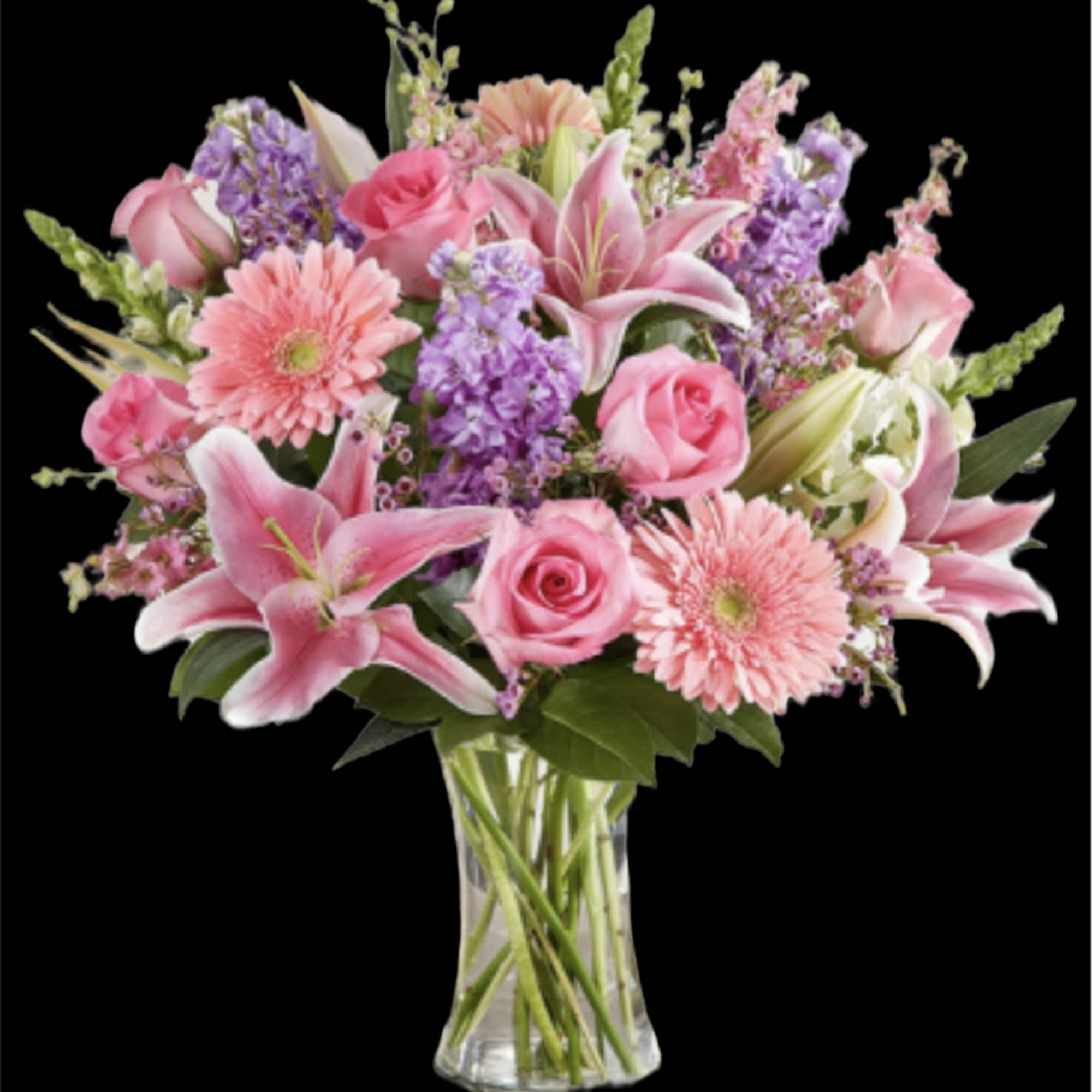 Pink and lavender mixed bouquet in a clear glass vase
