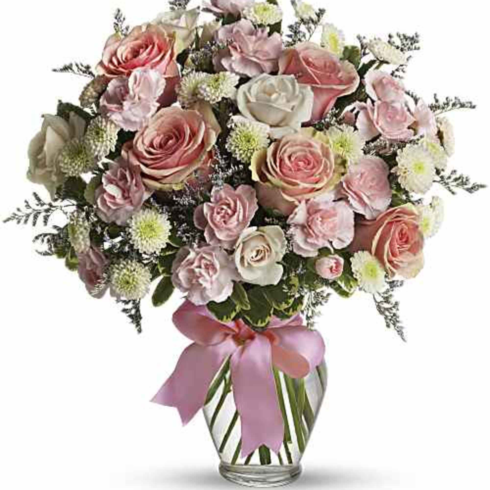 A dreamy pastel mix of pale pink and ivory roses makes this