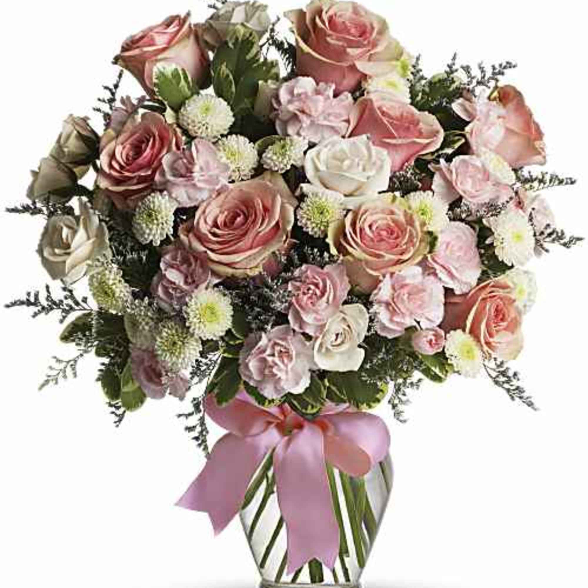 A dreamy pastel mix of pale pink and ivory roses makes this