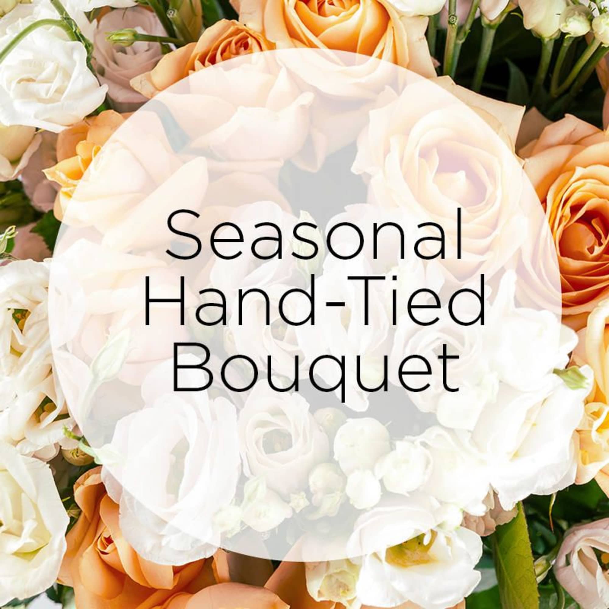 Hand-tied bouquet of white and peach roses