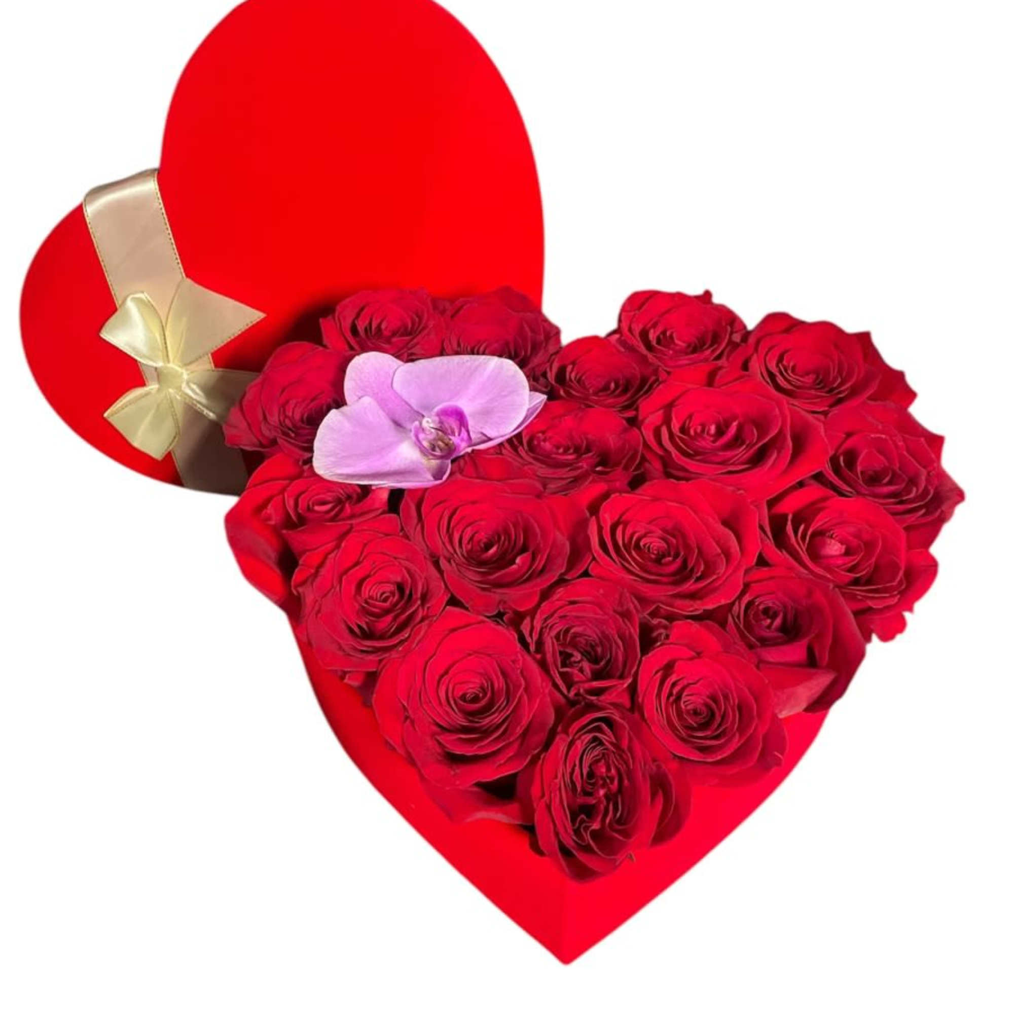 Heart-shaped red box filled with red roses and a pink orchid with a red lid tied in a gold bow