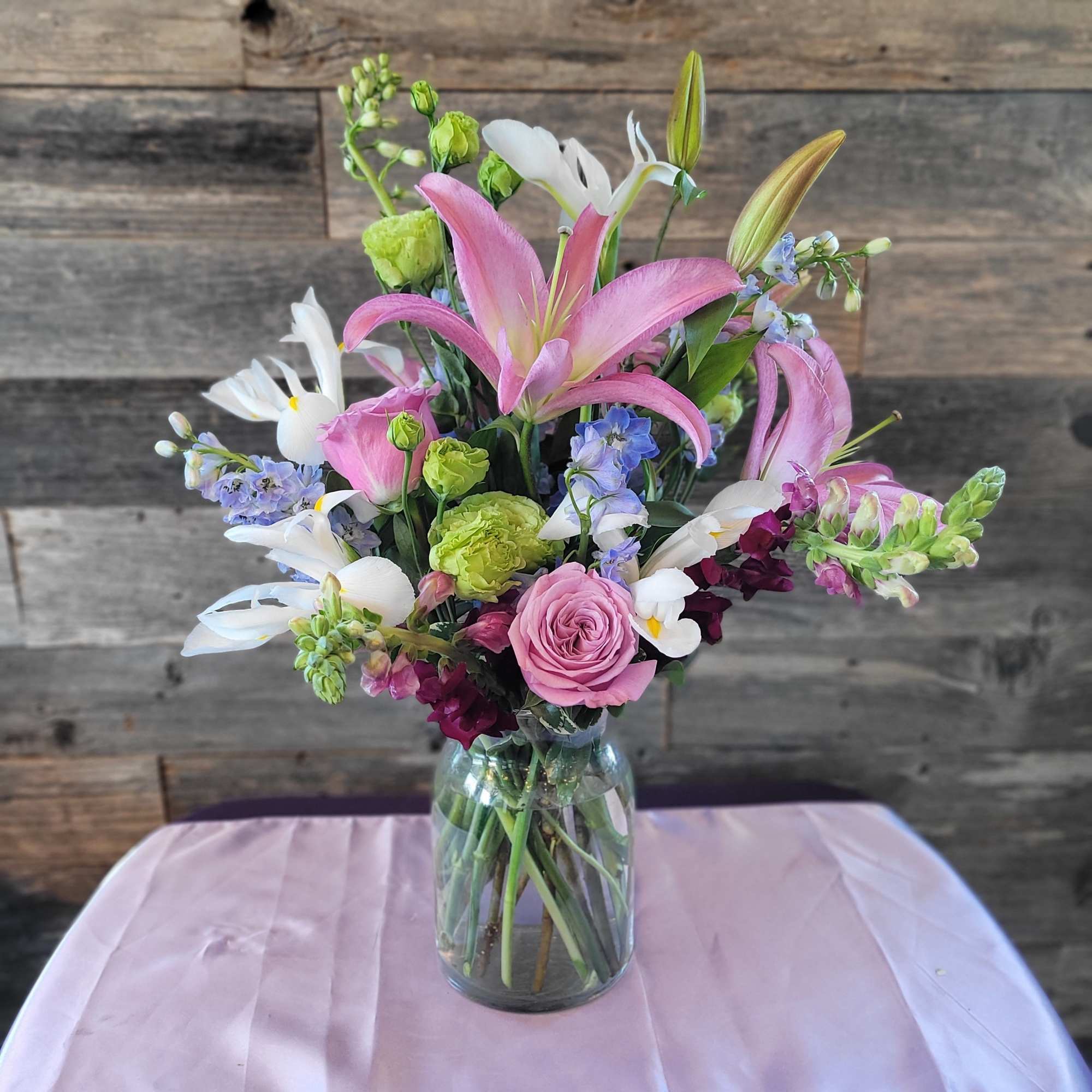 Roses, lilies, and friends! Pinks with touches of blue, white, and even