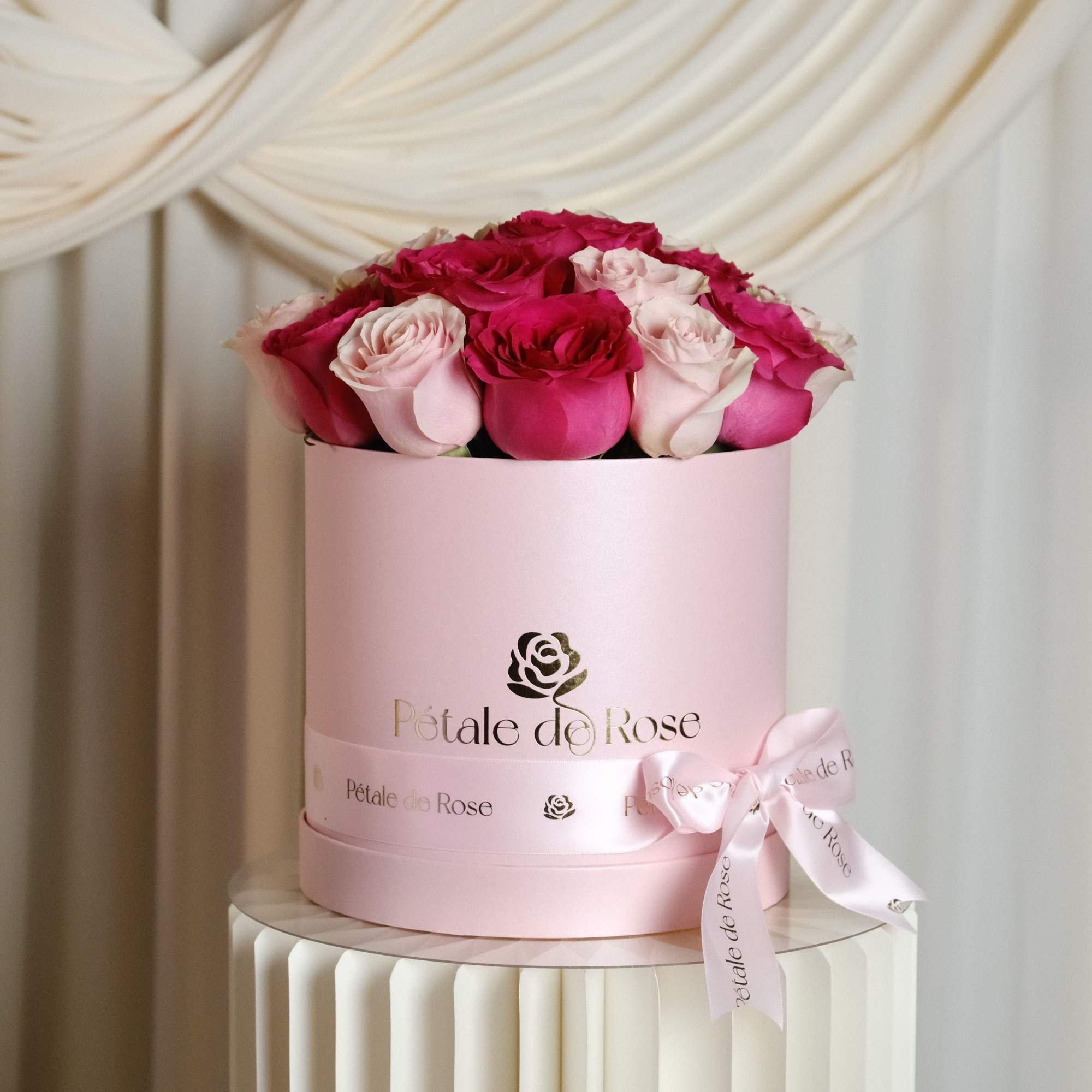 A romantic arrangement featuring premium pink and blush roses carefully designed in
