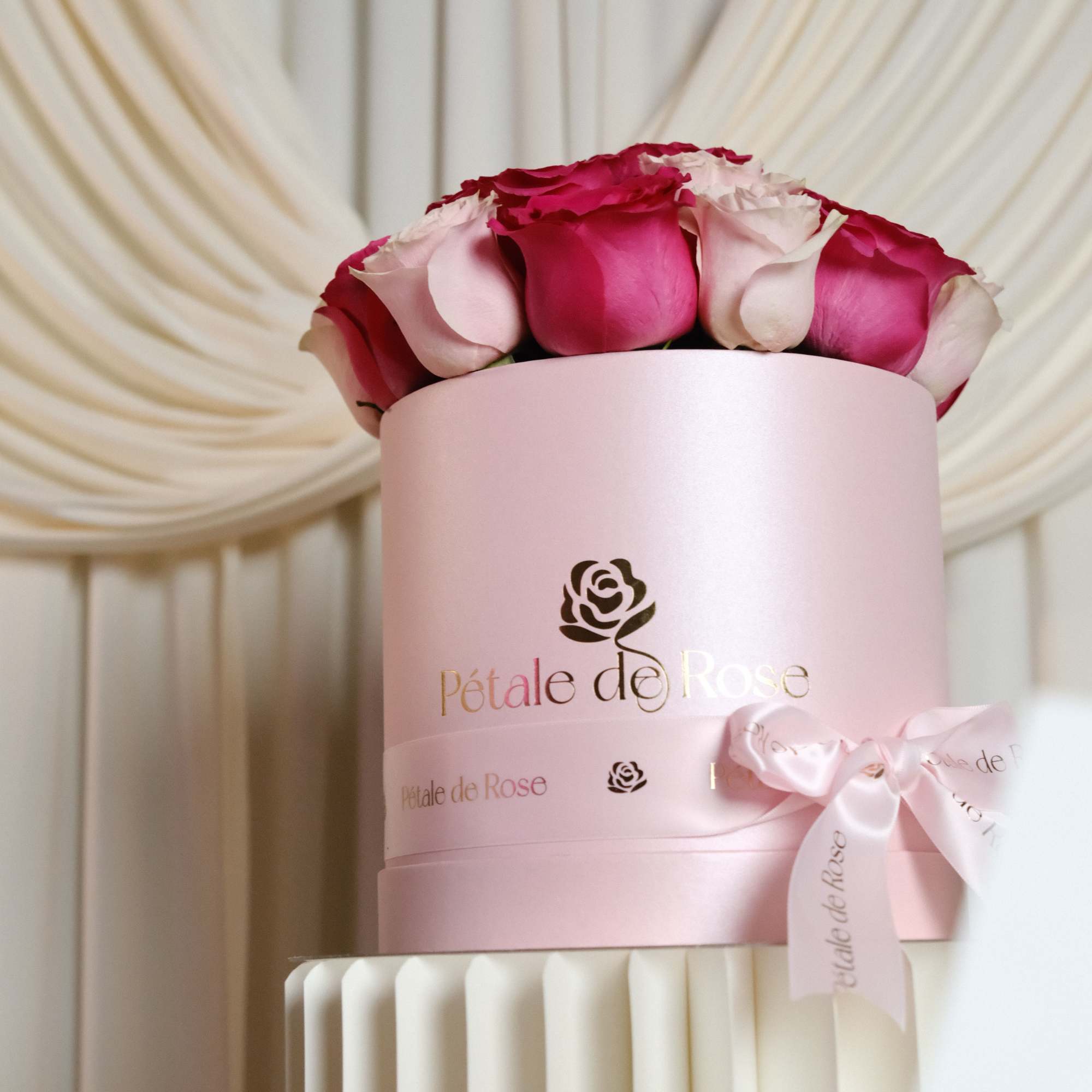 A romantic arrangement featuring premium pink and blush roses carefully designed in