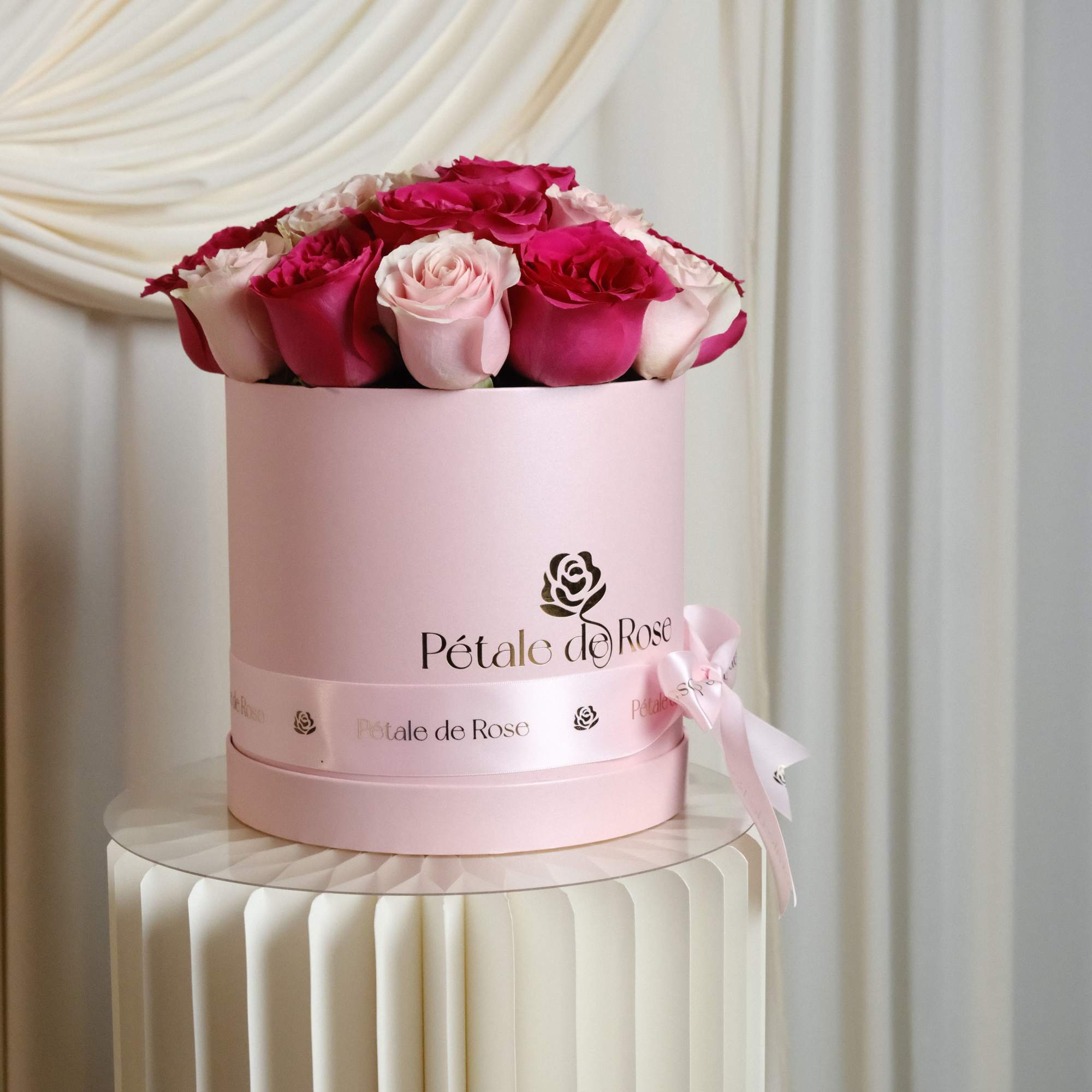 A romantic arrangement featuring premium pink and blush roses carefully designed in