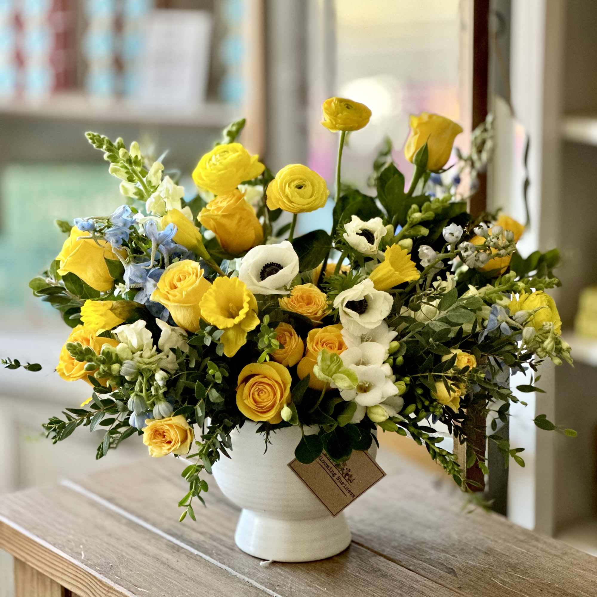 Lemon &amp; Ivory Luxe is a bright, elegant flower arrangement featuring golden