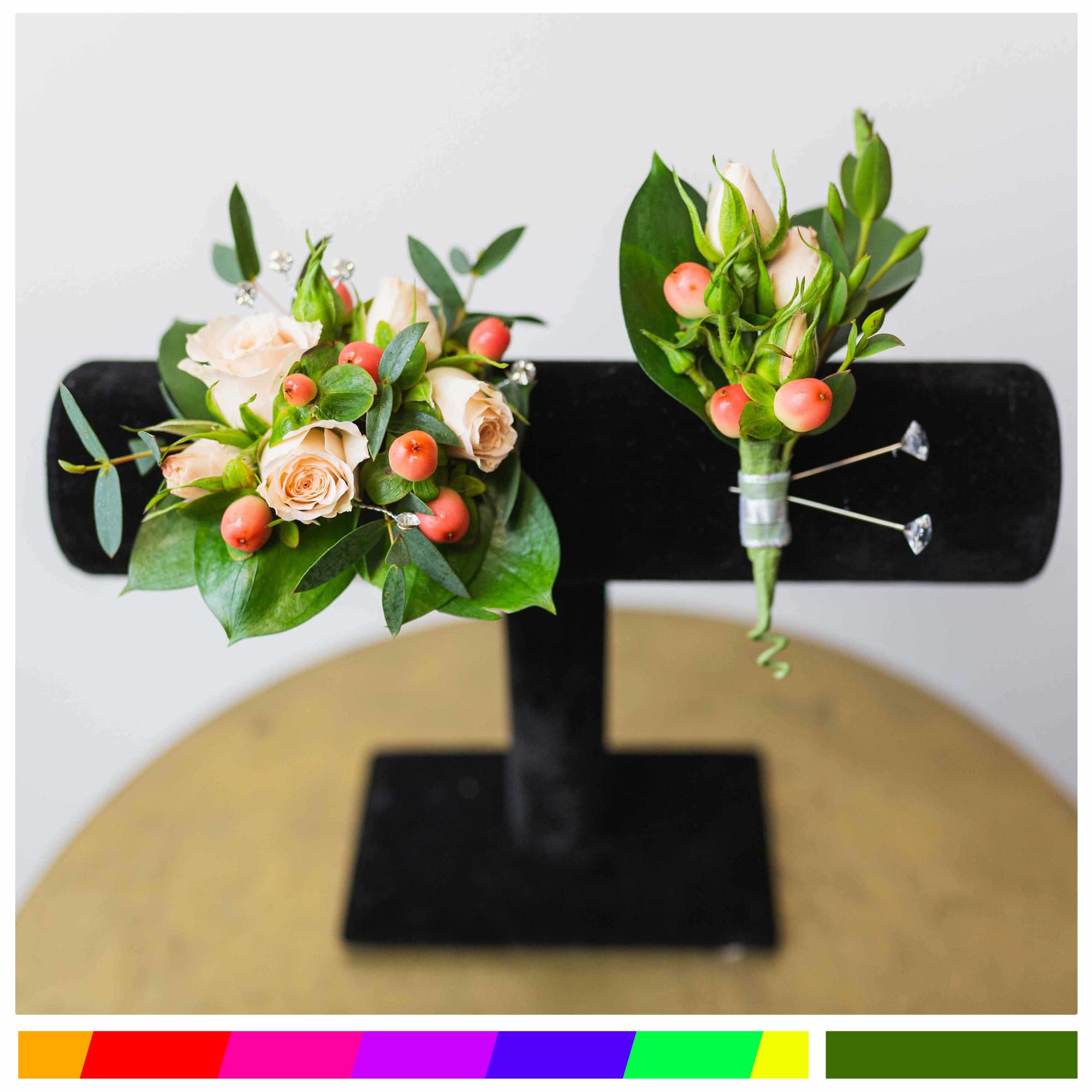 Boutonniere and small rose bouquet with peach blooms and berries