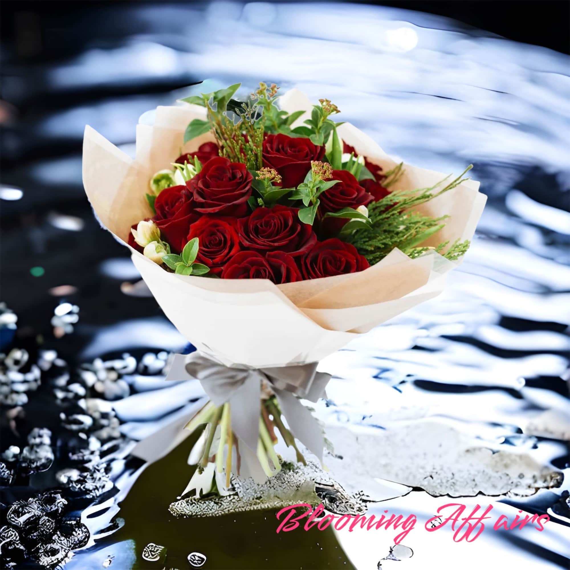 Bouquet of red roses wrapped in white paper with a ribbon