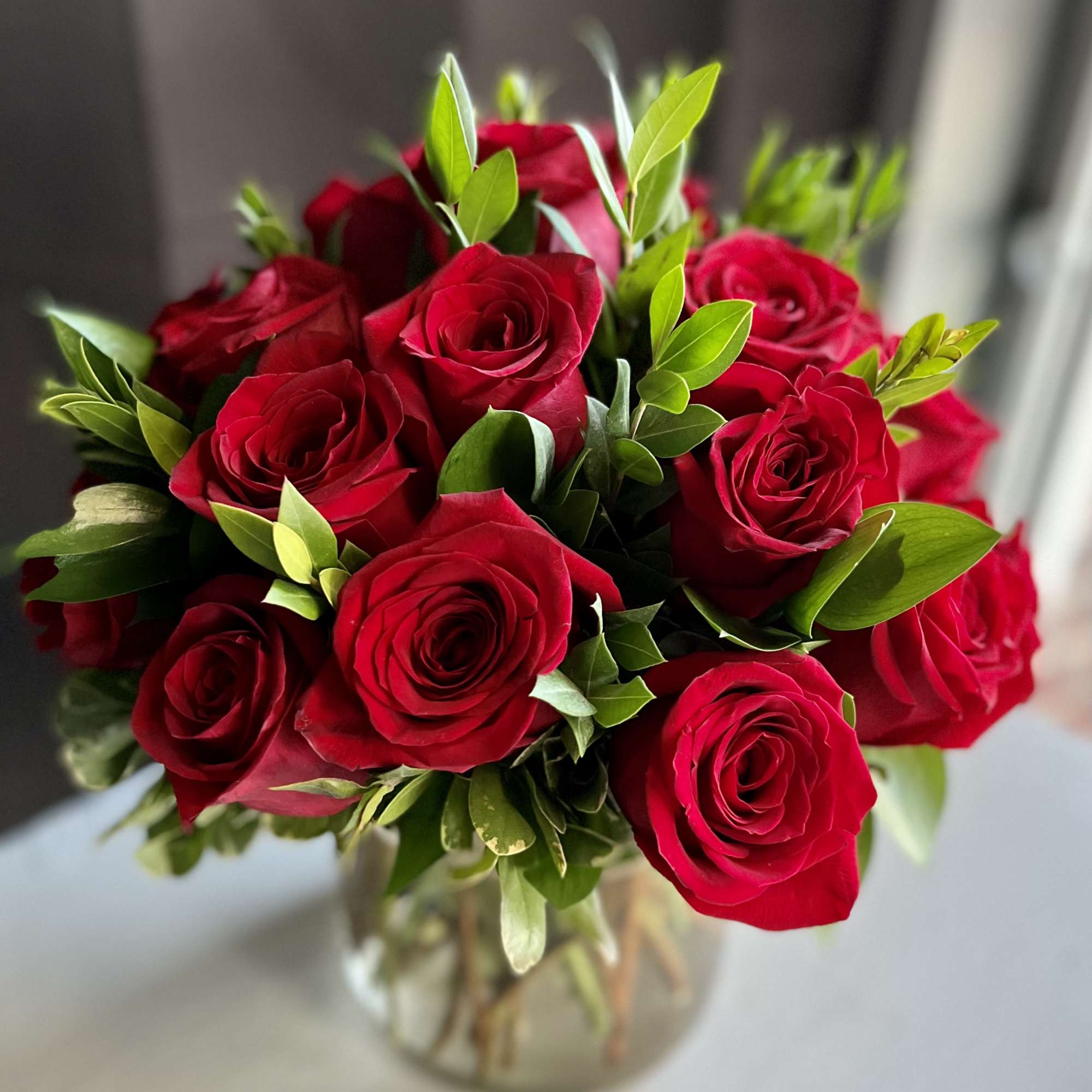 Bouquet of red roses in a clear glass vase