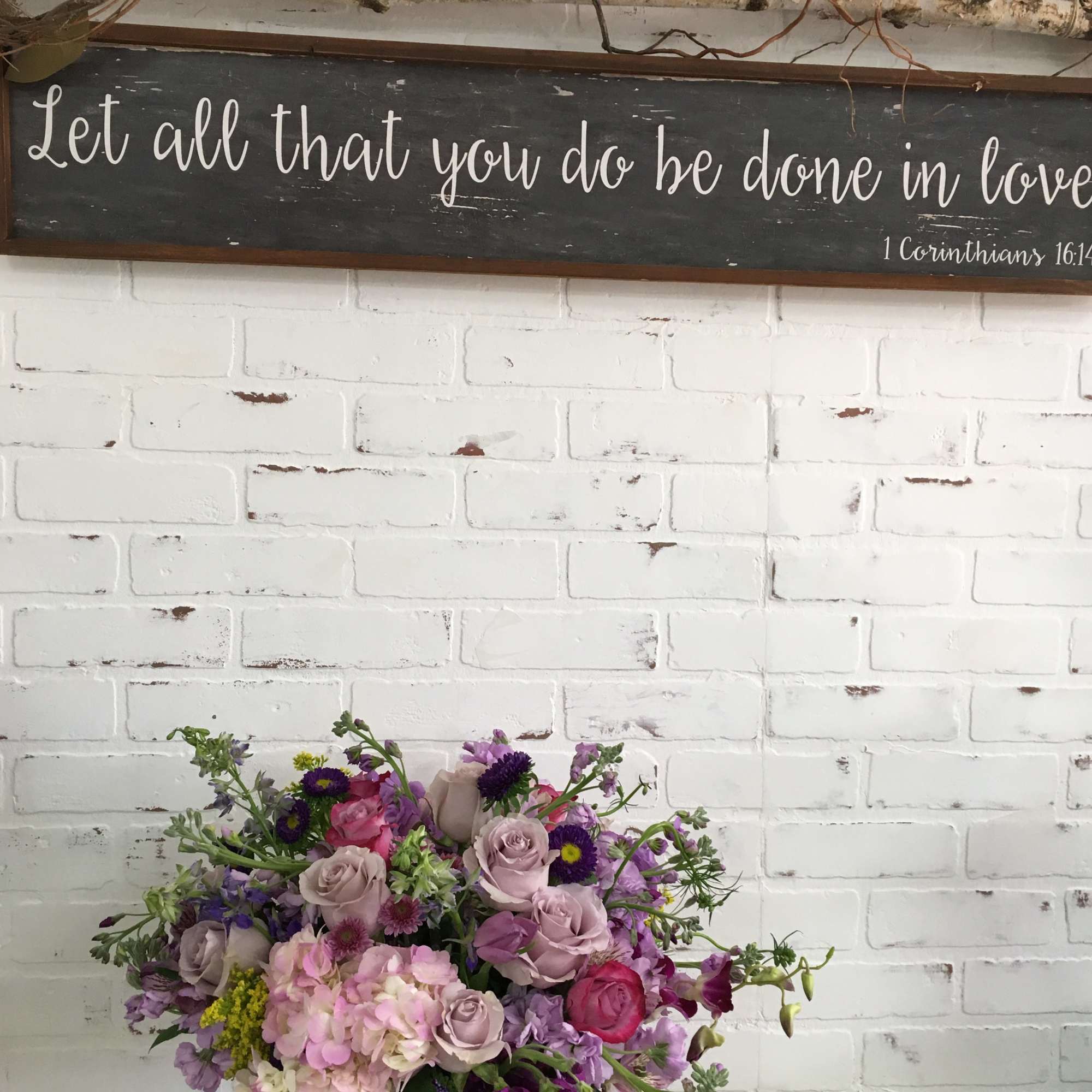 Mixed pink and purple flower bouquet in a glass vase